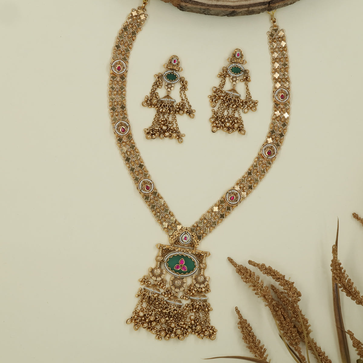 Floral mesh kundan long haara with dense link pattern and oval pendant with fringe drops