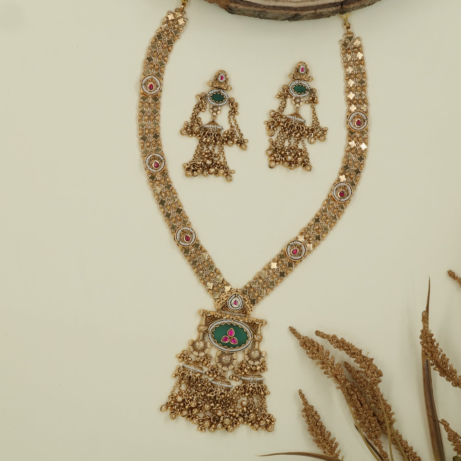 Floral mesh kundan long haara with dense link pattern and oval pendant with fringe drops