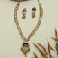 Dual strand kundan long haara with clustered bead chains and decorative enamel pendant with dangles