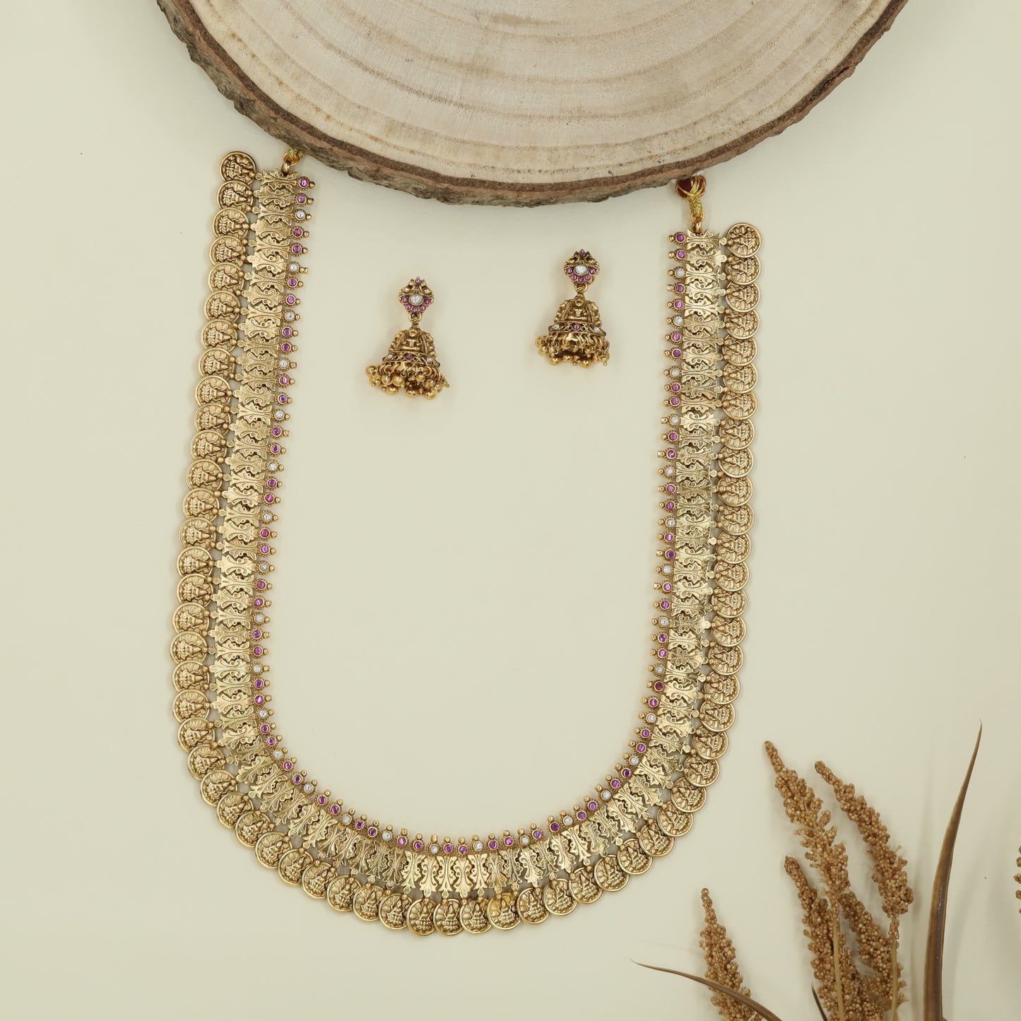 Disc chain antique long haara with repeating coins and sculpted figure connectors