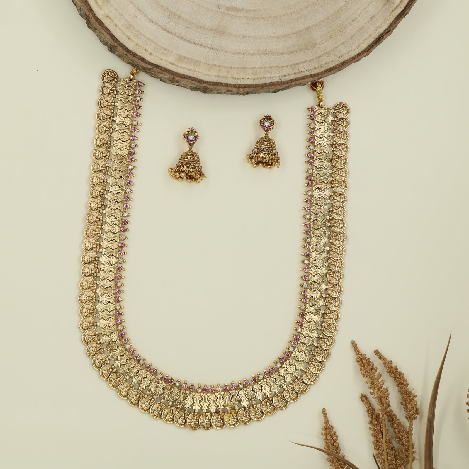 Disc chain antique long haara with repeating coins and sculpted figure connectors