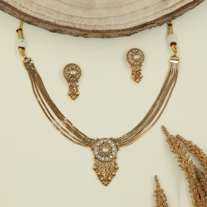 Multi strand chain kundan necklace with circular medallion pendant and fringe drop hangings