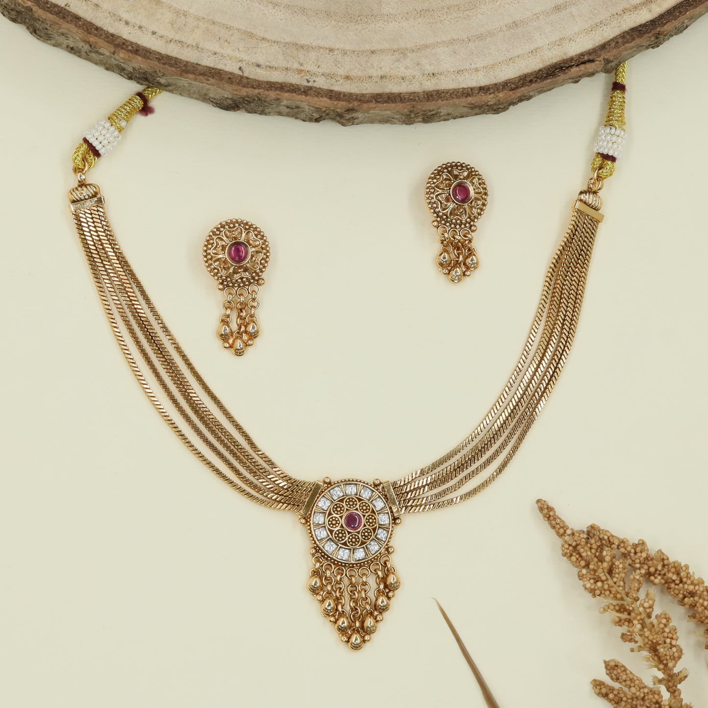 Multi strand chain kundan necklace with circular medallion pendant and fringe drop hangings