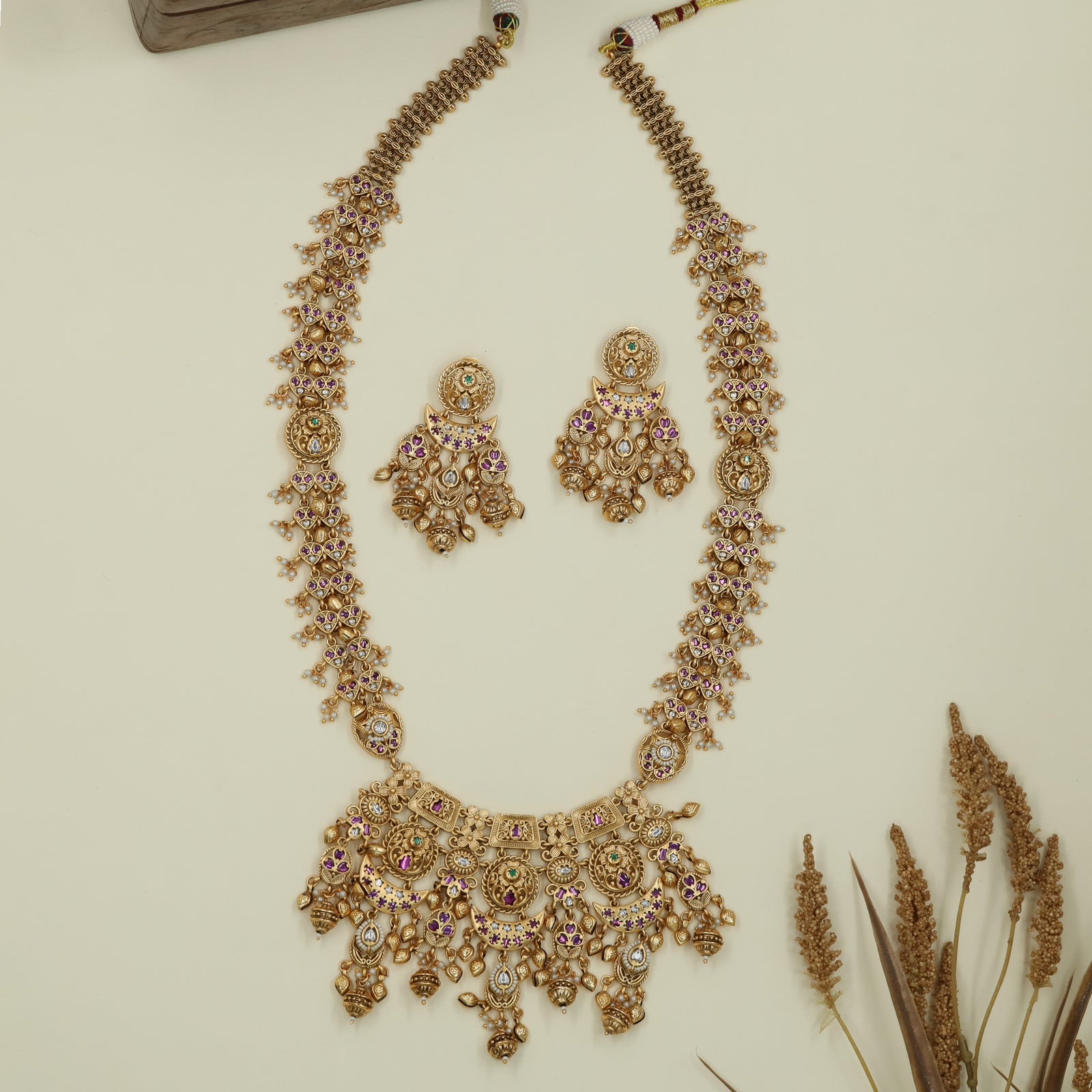 Floral lattice kundan long haara with tightly packed links and multi drop lower panel