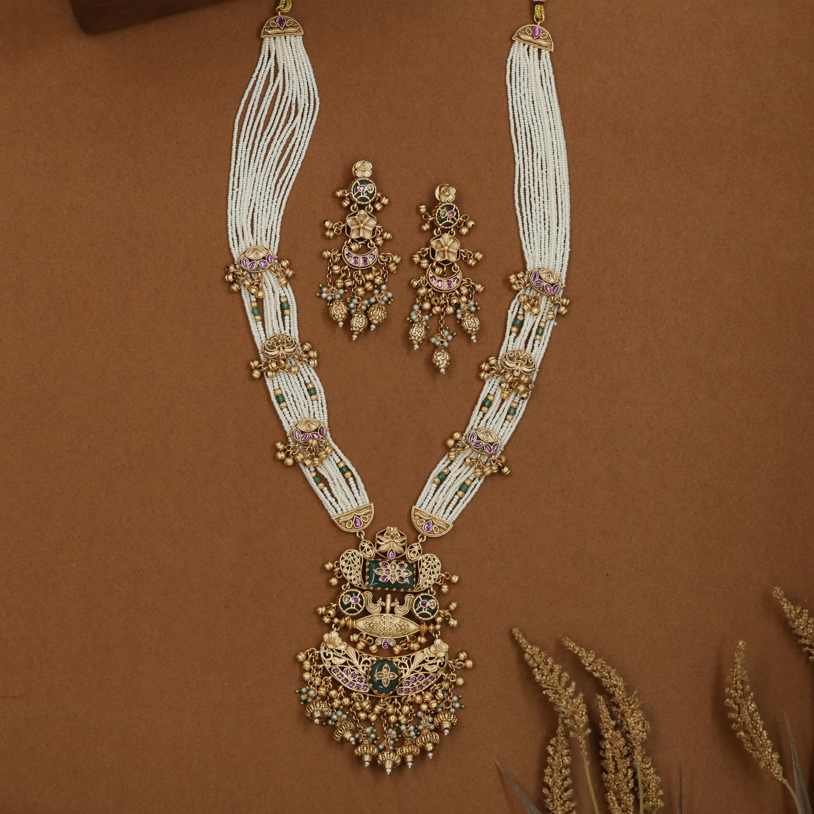 Arched pearl strand kundan long haara with side bead clusters and grand tiered pendant