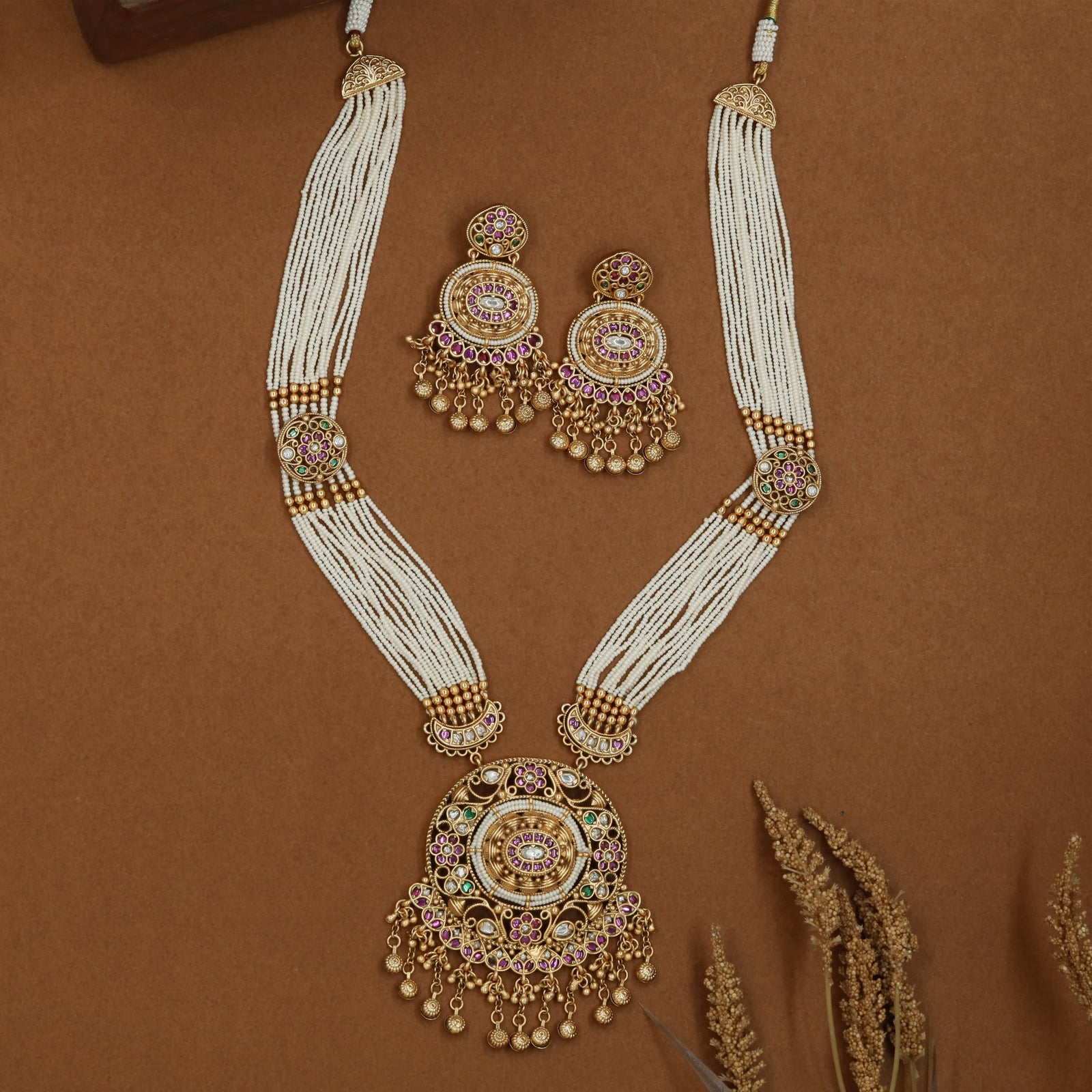 Aligned pearl strand kundan beads long haara with circular side connectors