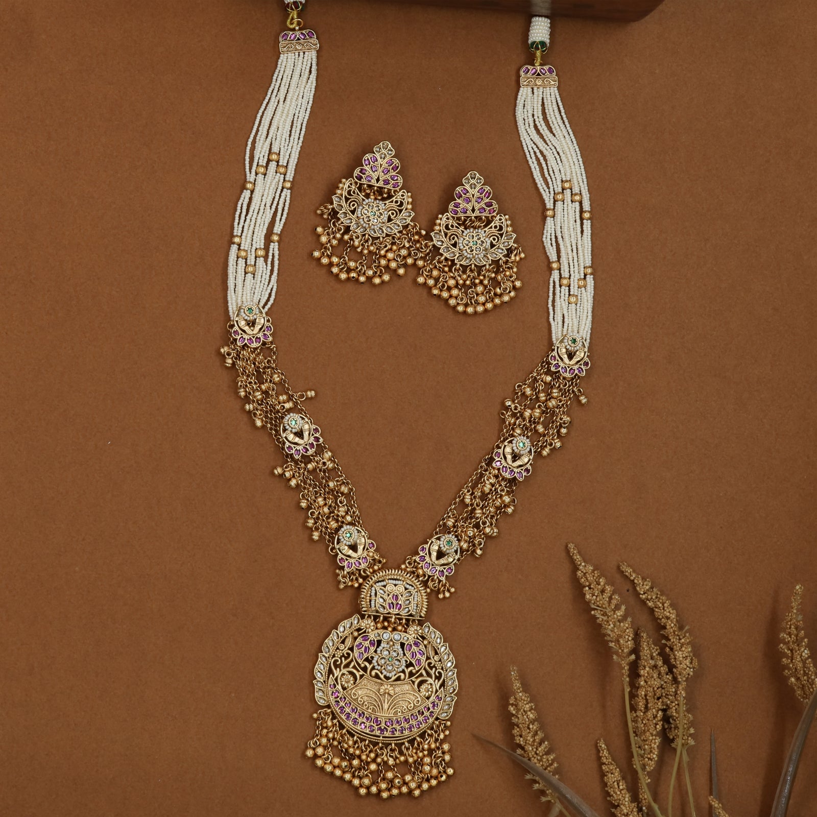 Dual texture kundan long haara with pearl bunch upper links and flowing bead drop chains
