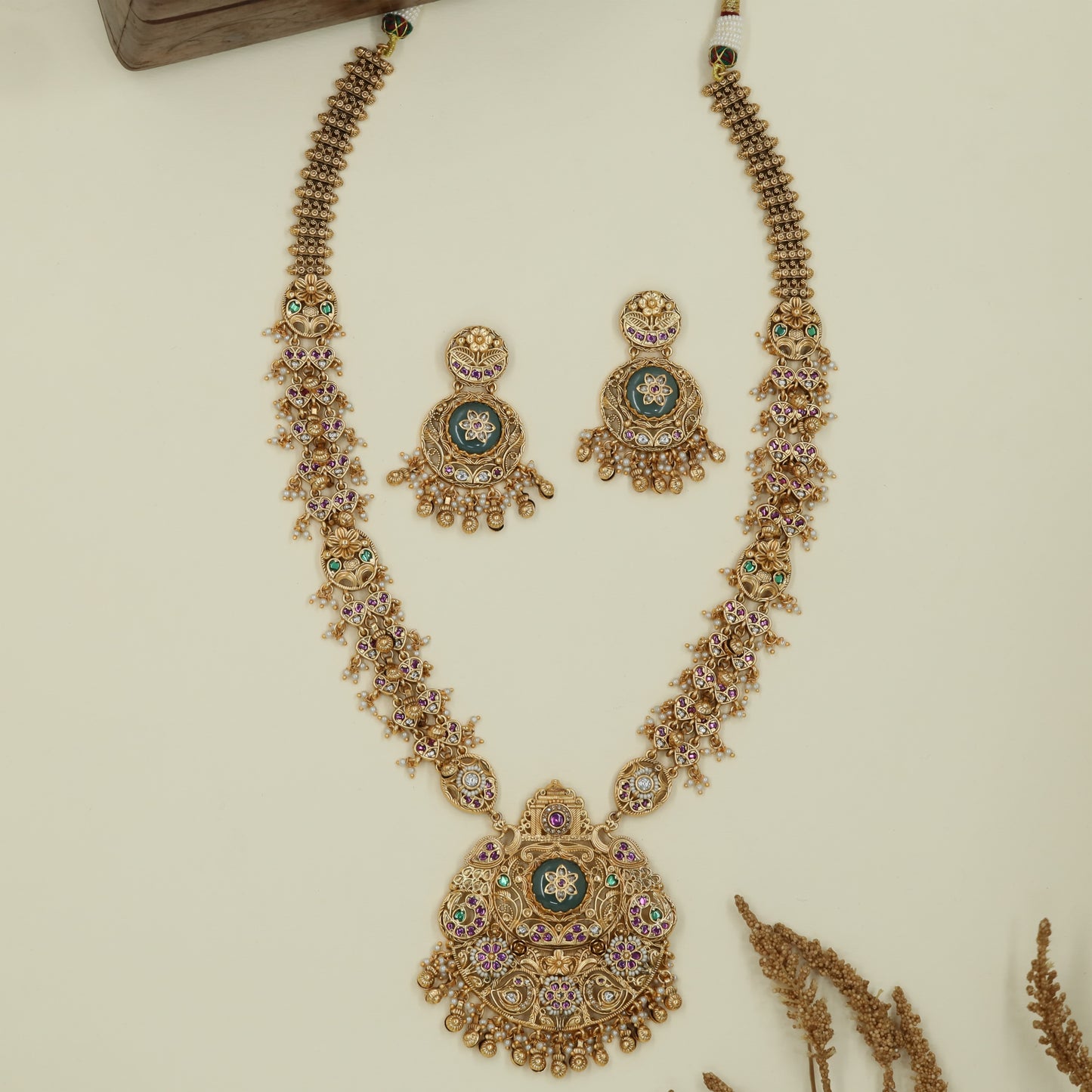 Graceful peacock kundan long haara with structured links and multi drop circular pendant