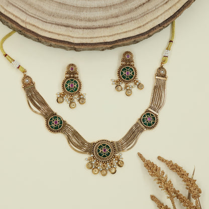 Floral panel kundan necklace with mesh strands and circular connectors with fringe drops