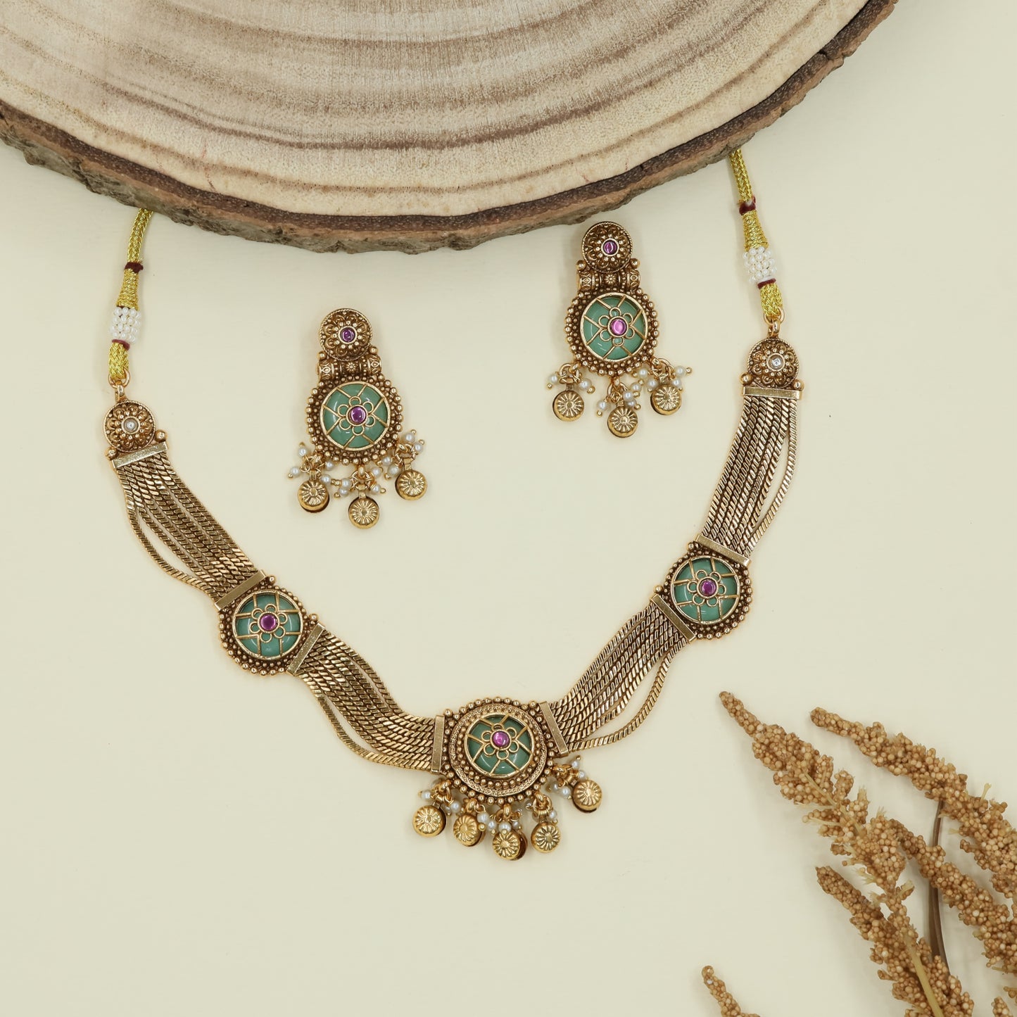 Floral panel kundan necklace with mesh strands and circular connectors with fringe drops