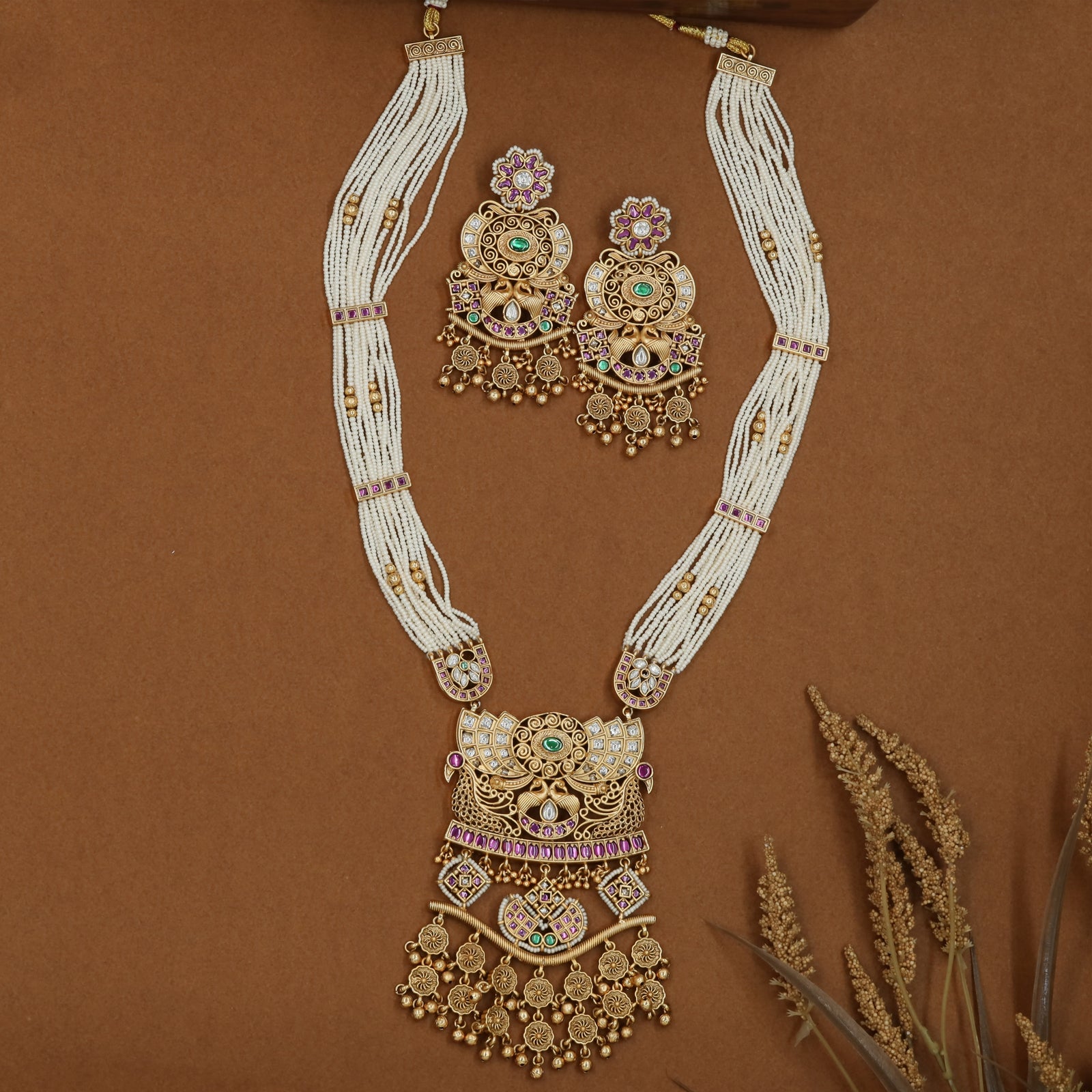 Pearl strand kundan long haara with gathered side bunches and grand temple drop pendant