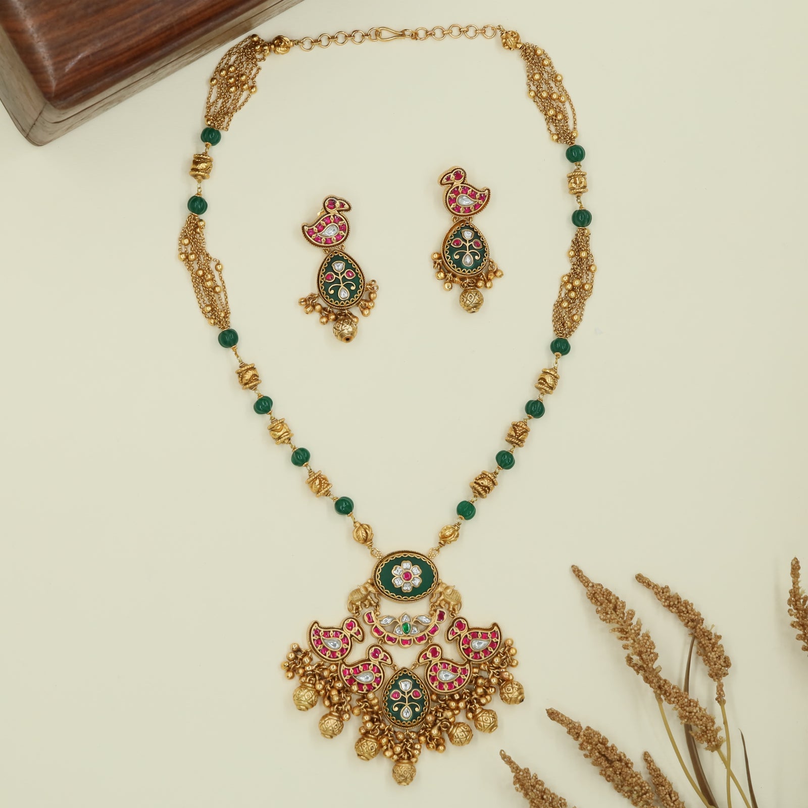 Swan panel kundan long haara with segmented beads and layered drop pendant