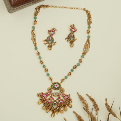 Swan accent kundan long haara with spaced bead chain and clustered drop pendant