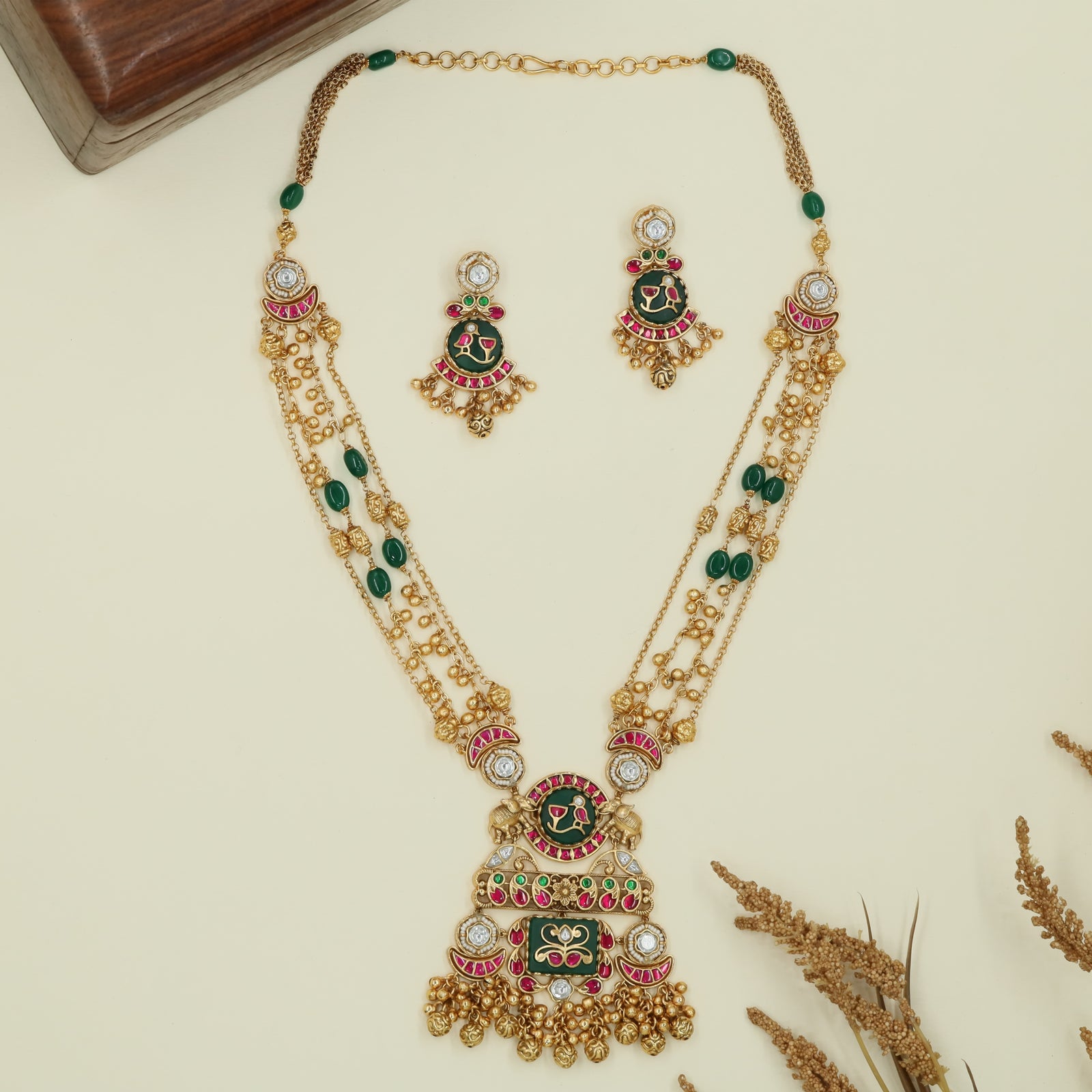 Multi strand kundan long haara with spaced oval beads and grand drop centerpiece