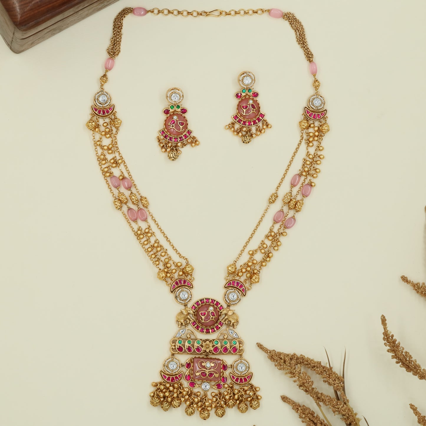 Multi strand kundan long haara with spaced oval beads and grand drop centerpiece