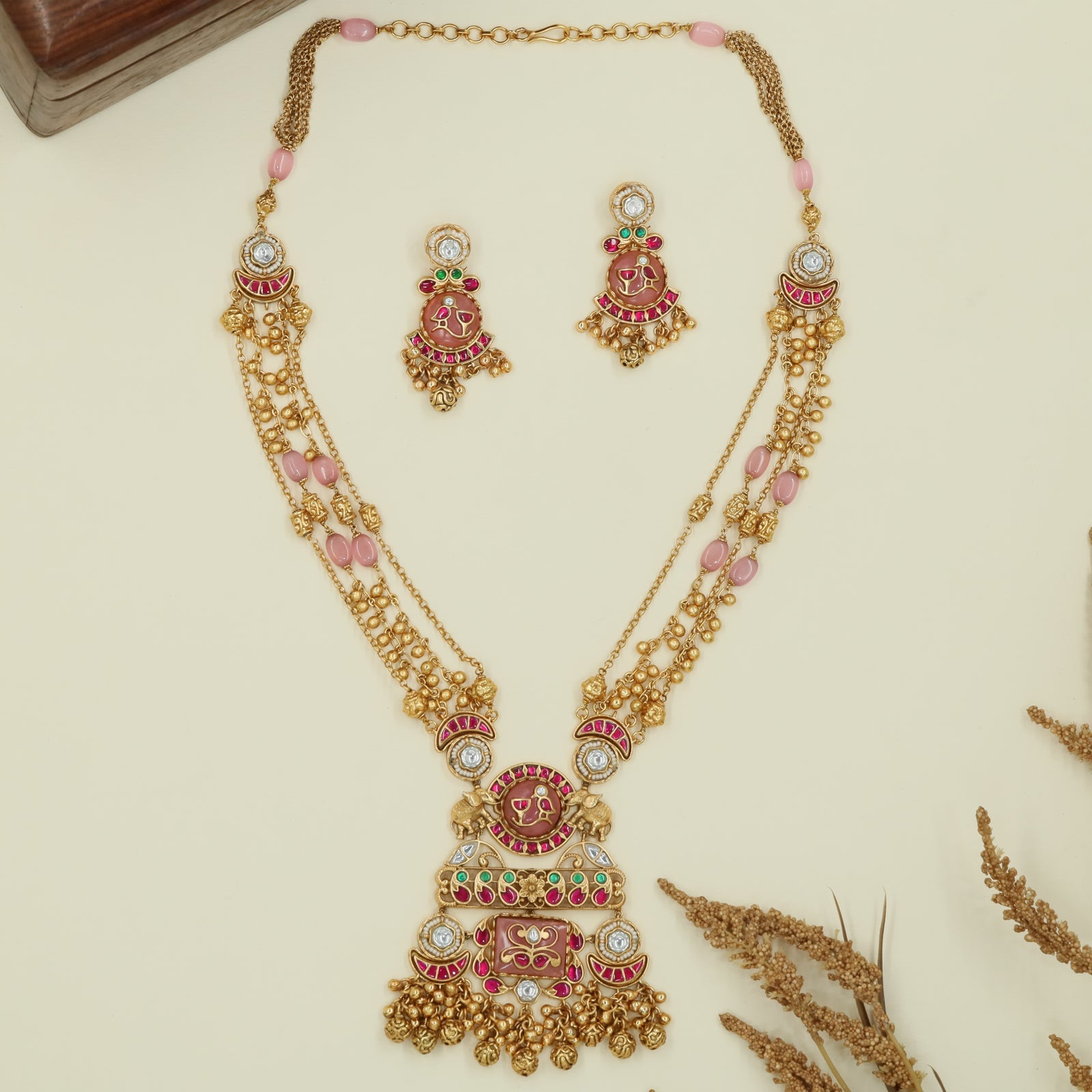 Multi strand kundan long haara with spaced oval beads and grand drop centerpiece