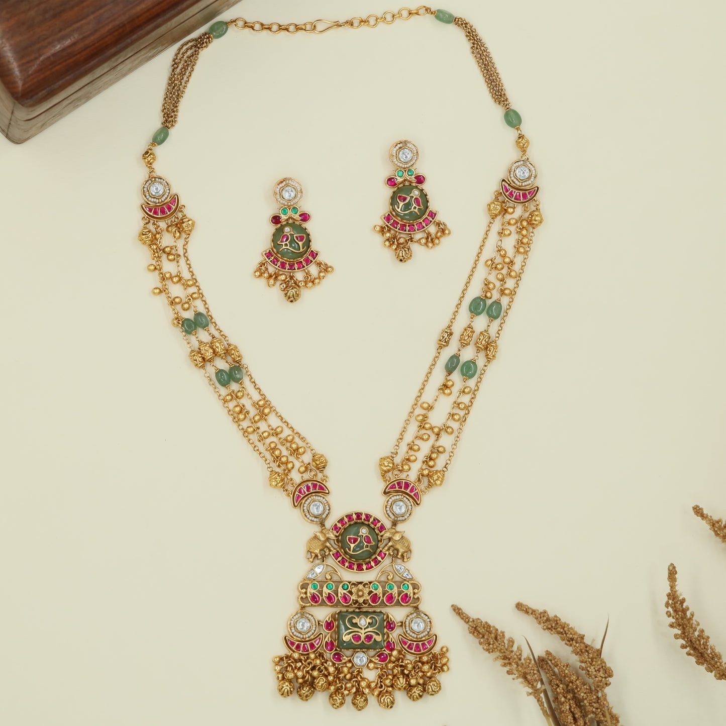 Multi strand kundan long haara with spaced oval beads and grand drop centerpiece