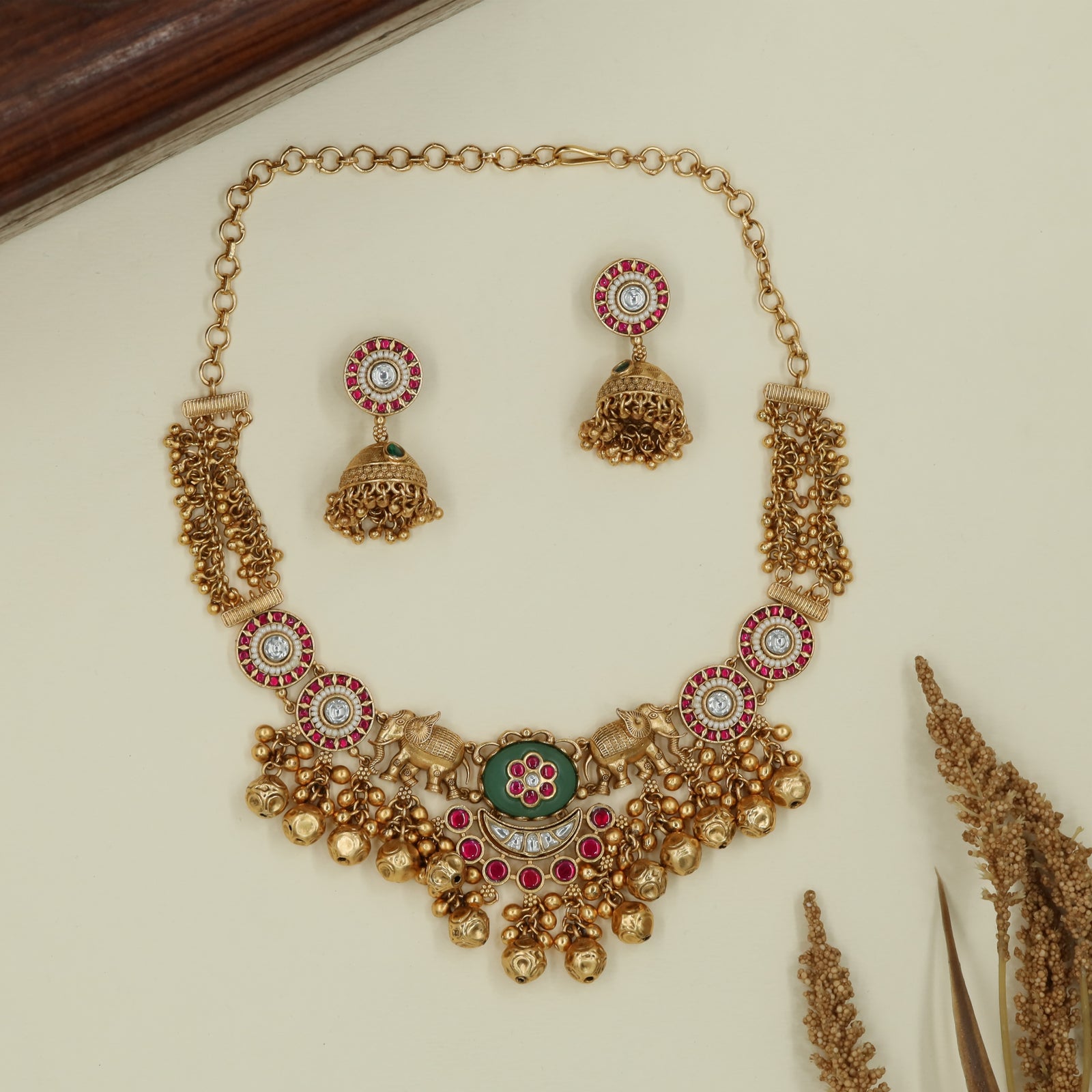 Decorative panel kundan necklace with twin elephant connectors and drops