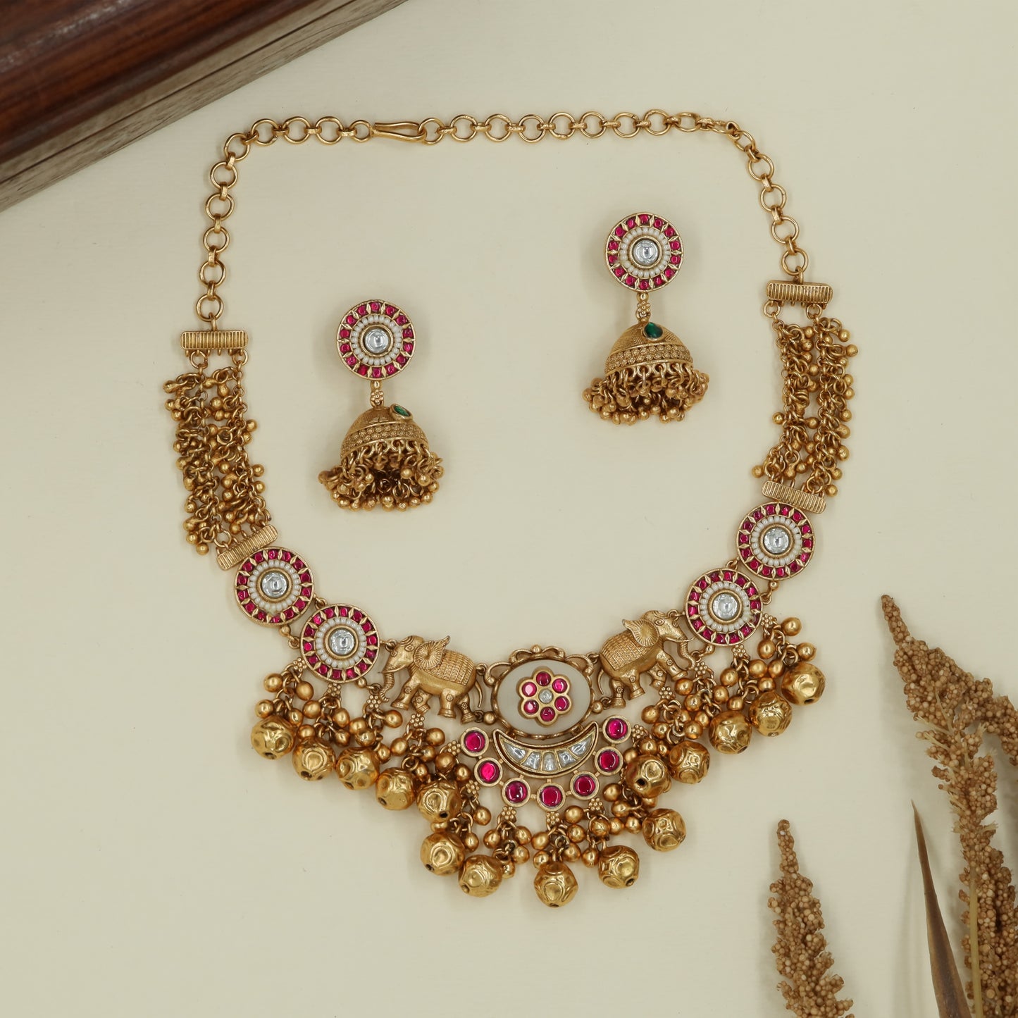 Decorative panel kundan necklace with twin elephant connectors and drops