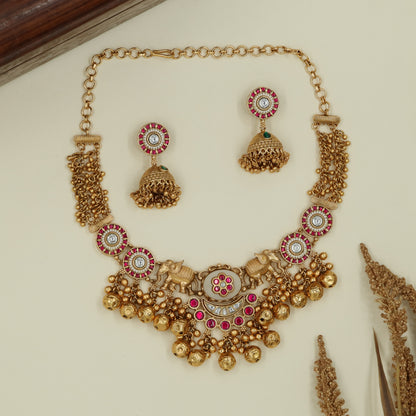 Decorative panel kundan necklace with twin elephant connectors and drops