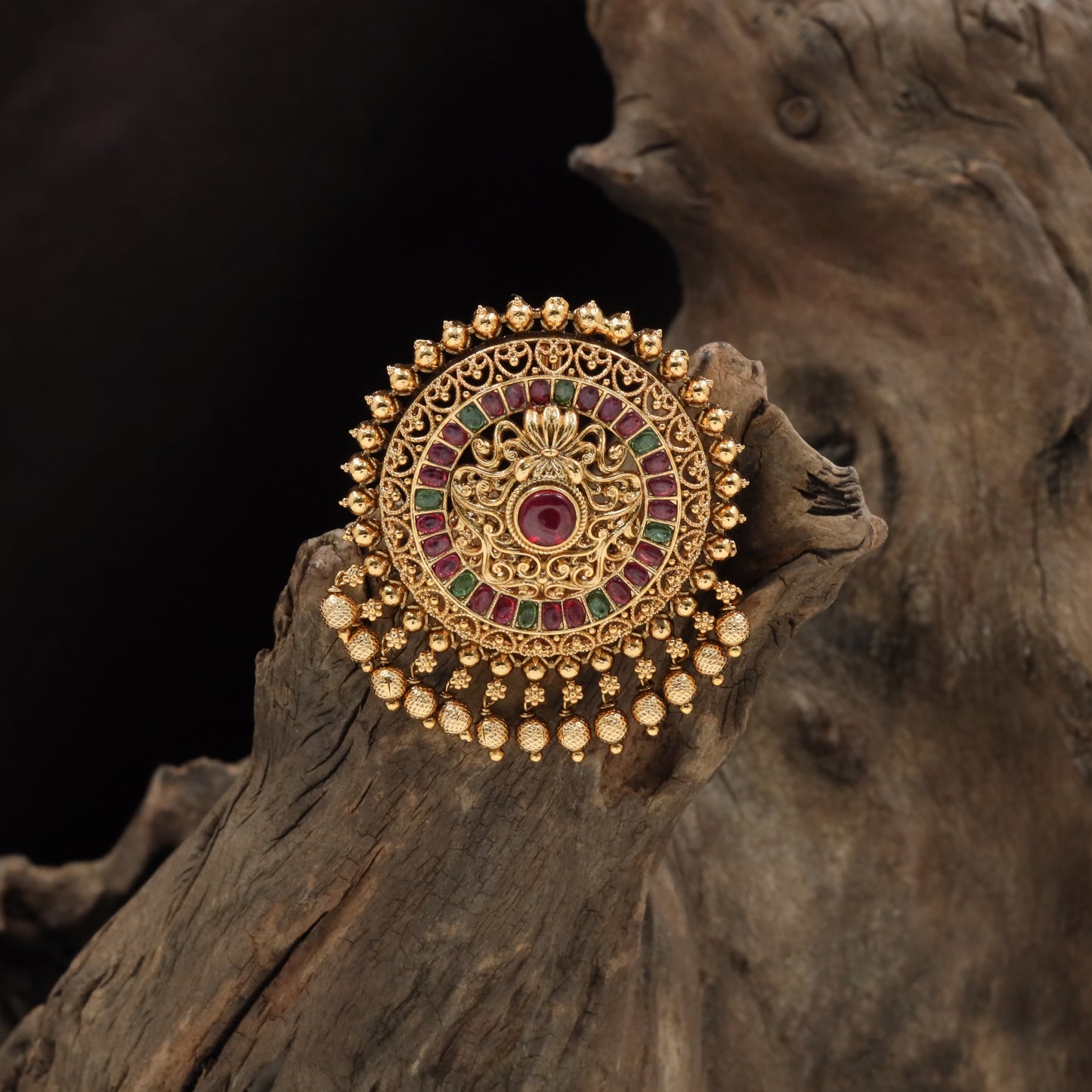 Beaded rim jade bille with layered concentric panels and drop hangings