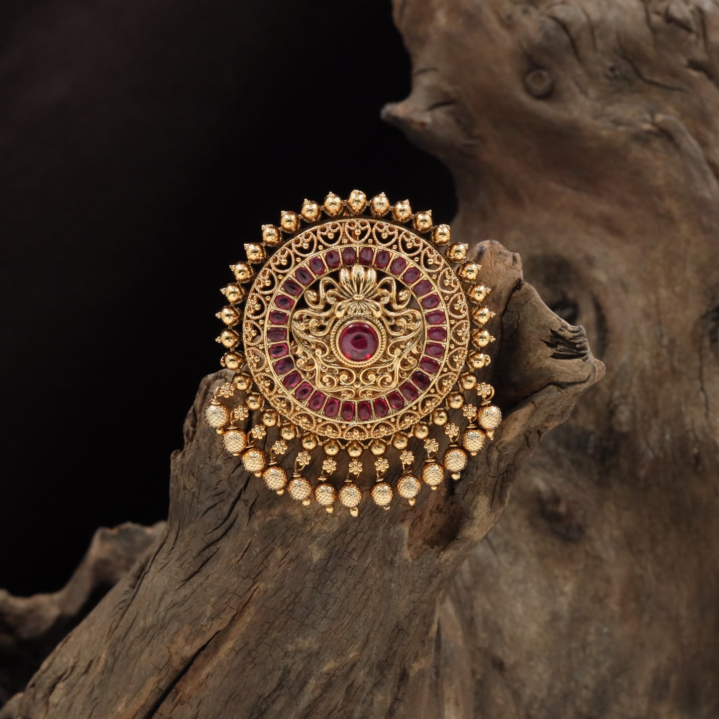Beaded rim jade bille with layered concentric panels and drop hangings