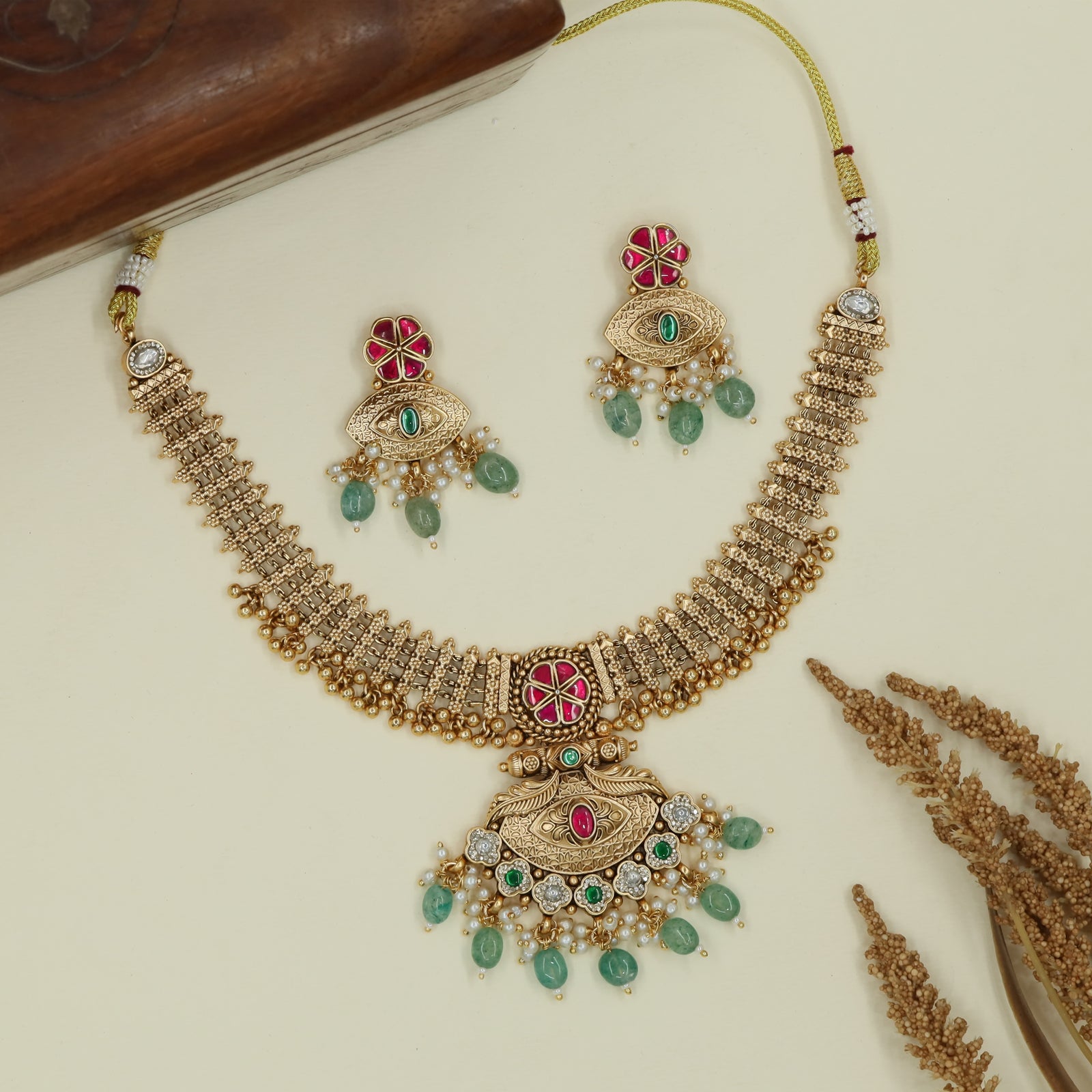 Peacock curve antique necklace with aligned strip links and drop centerpiece