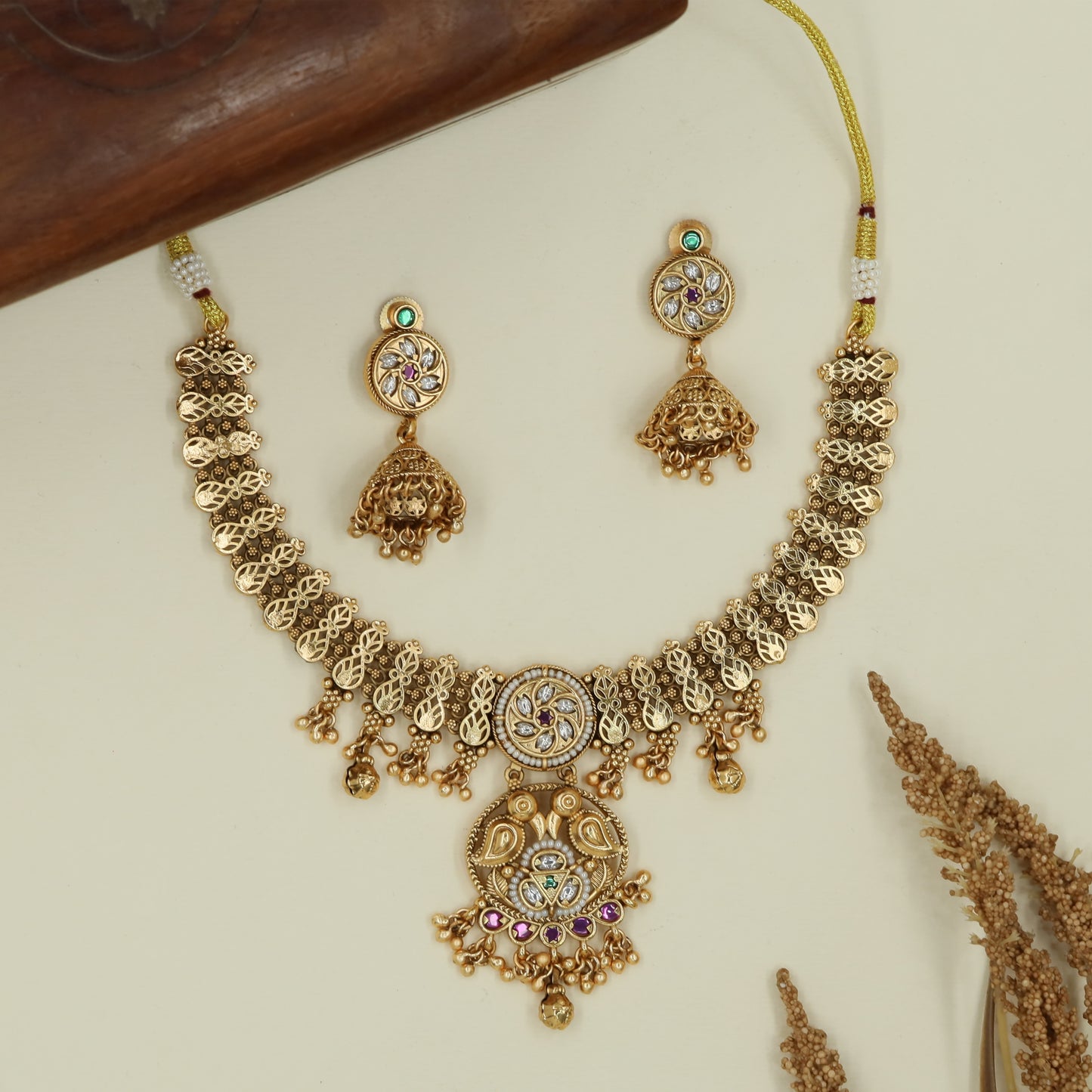 Floral leaf kundan necklace with alternating oval panels and fringe edge