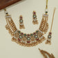 Jali disc kundan choker with structured rounds and hanging leaf fringe