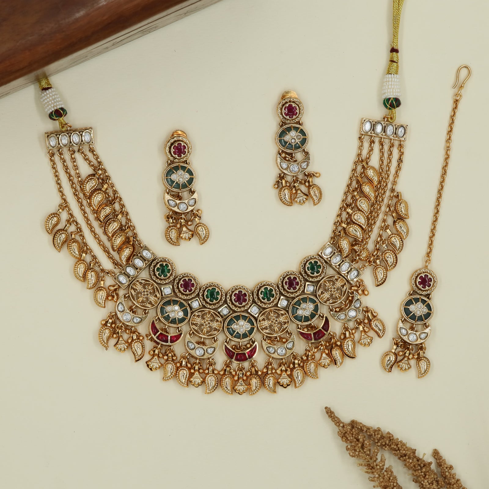 Jali disc kundan choker with structured rounds and hanging leaf fringe