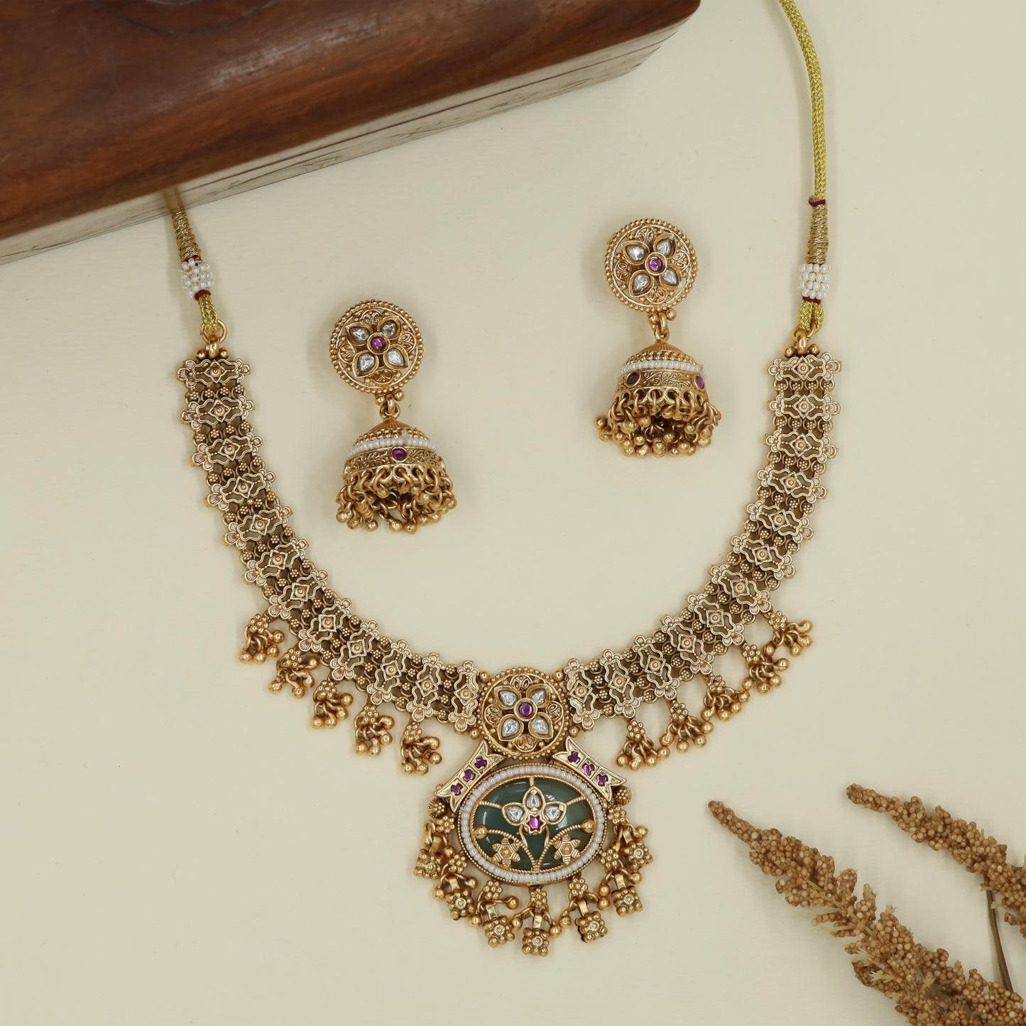 Floral grid kundan necklace with dense connectors and oval pendant fringe