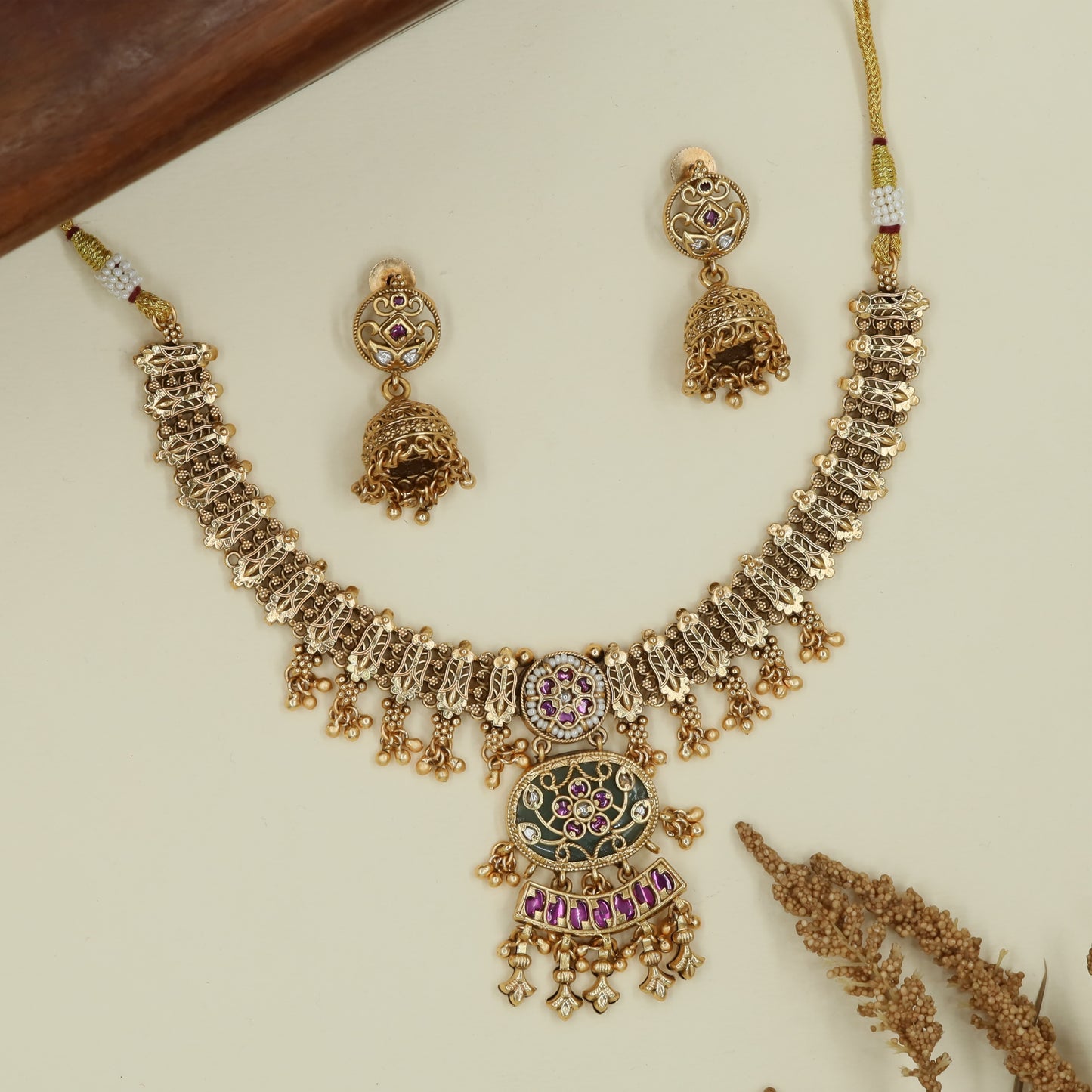 Interlock chain kundan necklace with mesh panels and hanging bead clusters