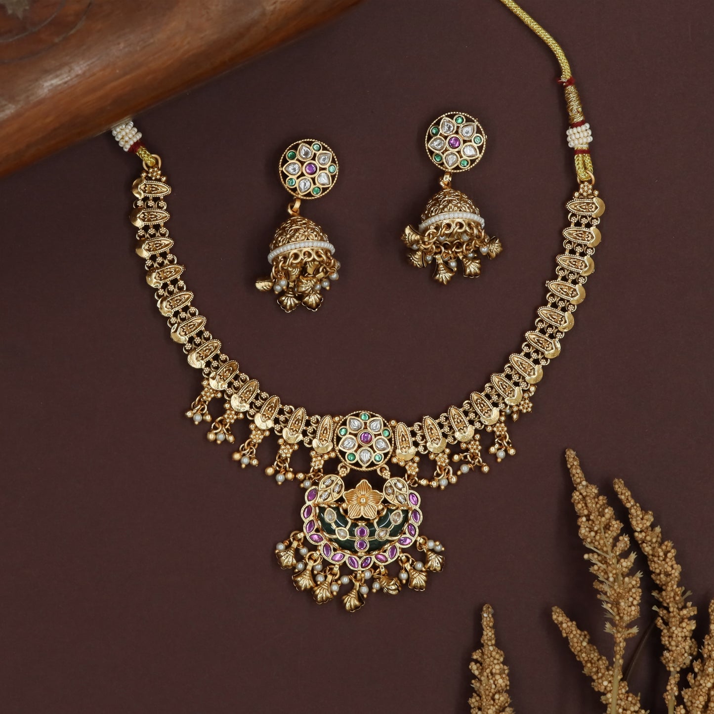 Hanging cluster kundan necklace with linked segments and ornate pendant unit