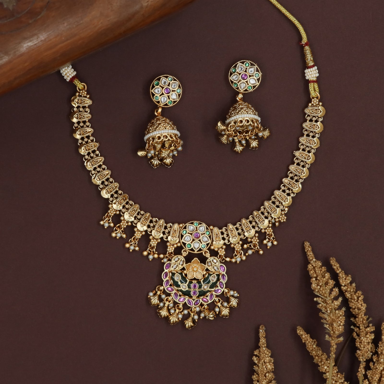Hanging cluster kundan necklace with linked segments and ornate pendant unit