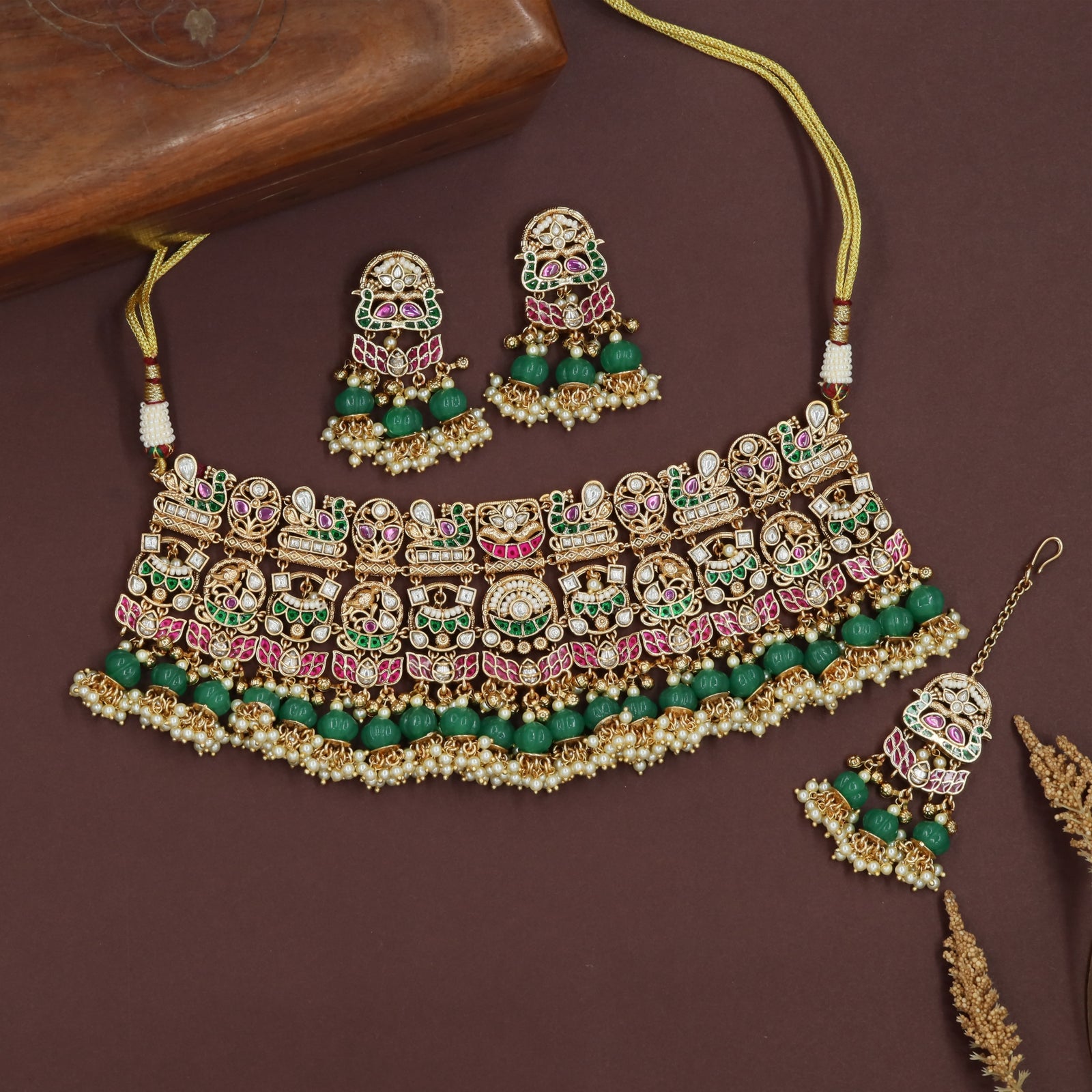 Broad panel kundan choker with multi shape units and bead fringe rows