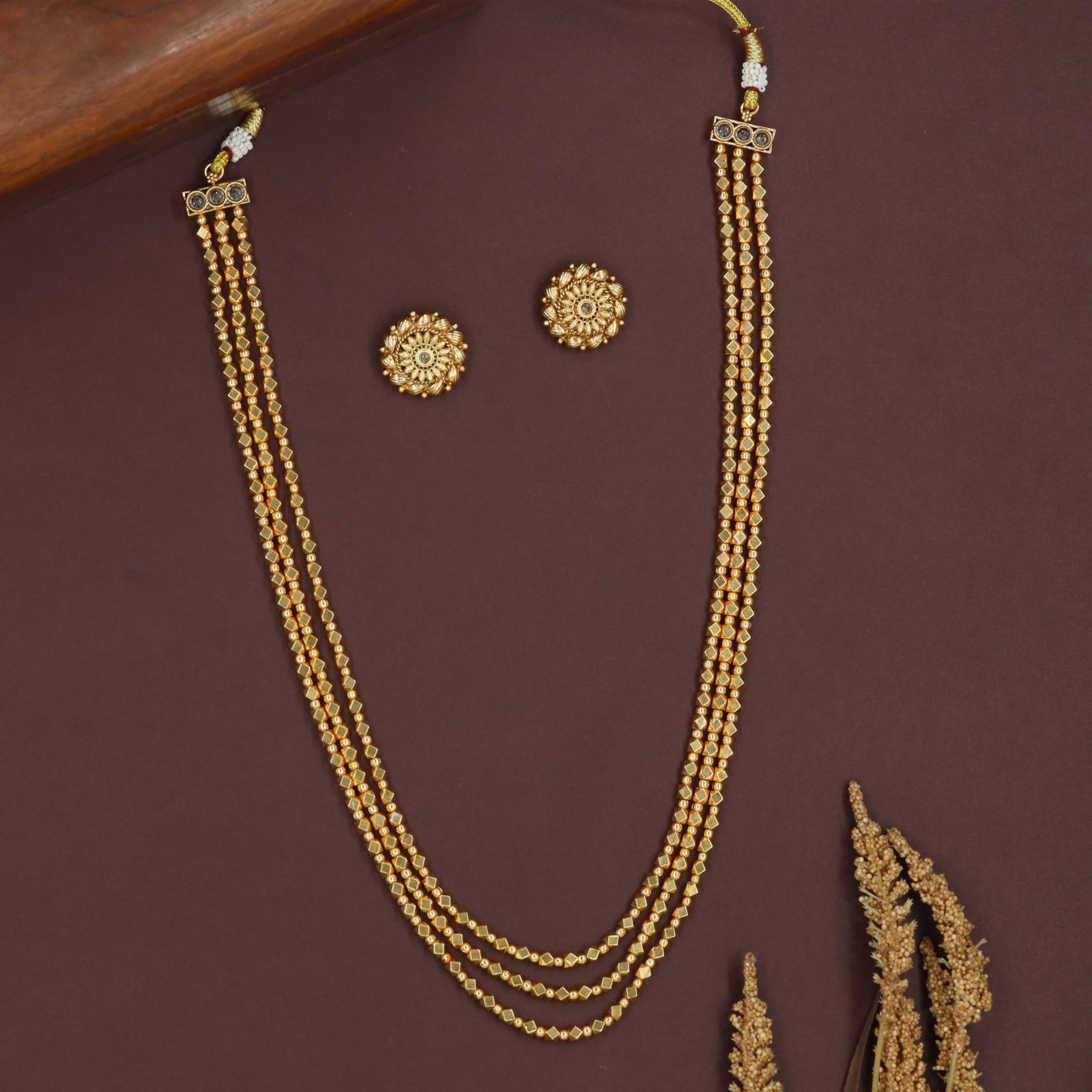 Triple line antique beads necklace with evenly spaced bead rows and rectangular top links