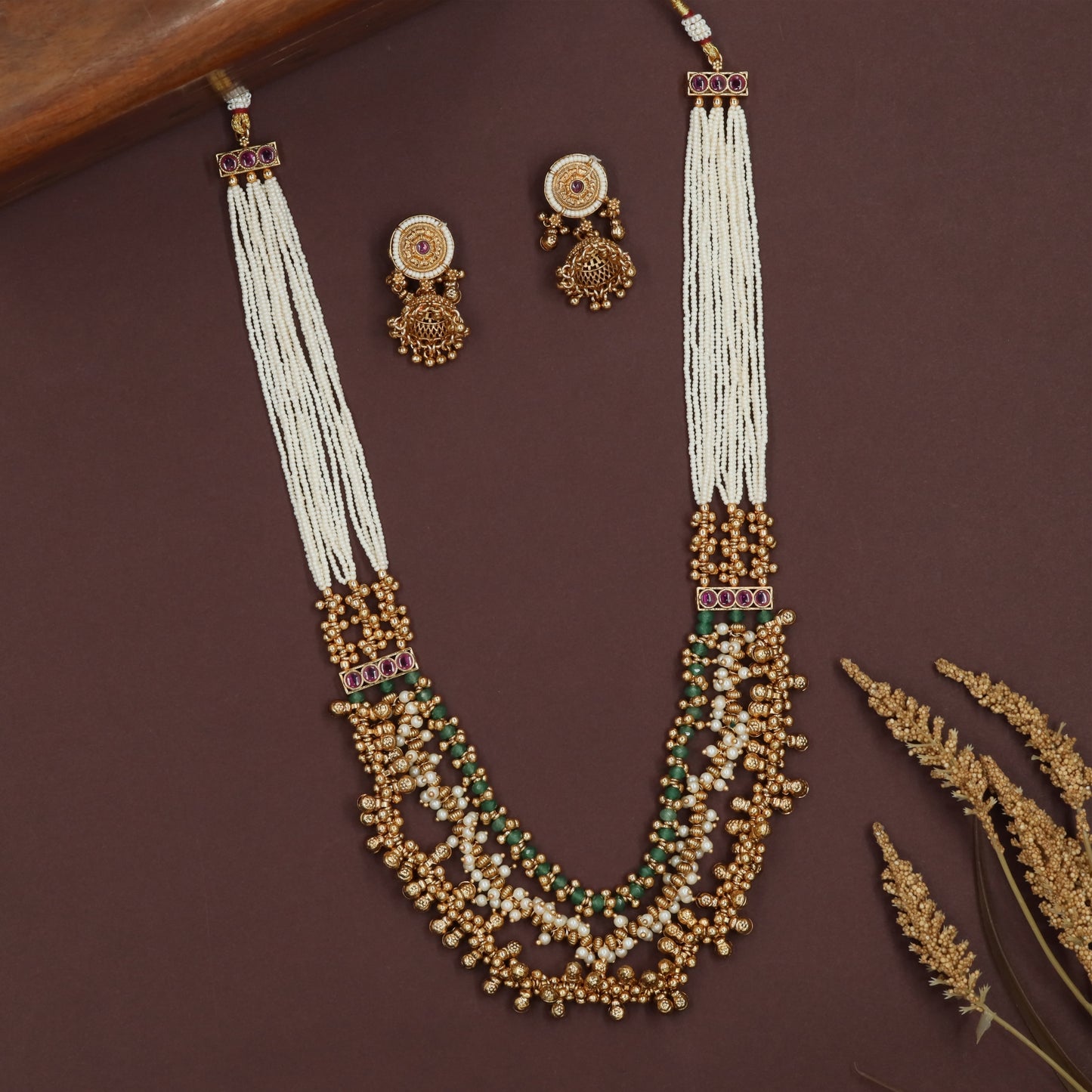 Multi strand pearl antique beads necklace with long layered strings and ornate bead cluster base