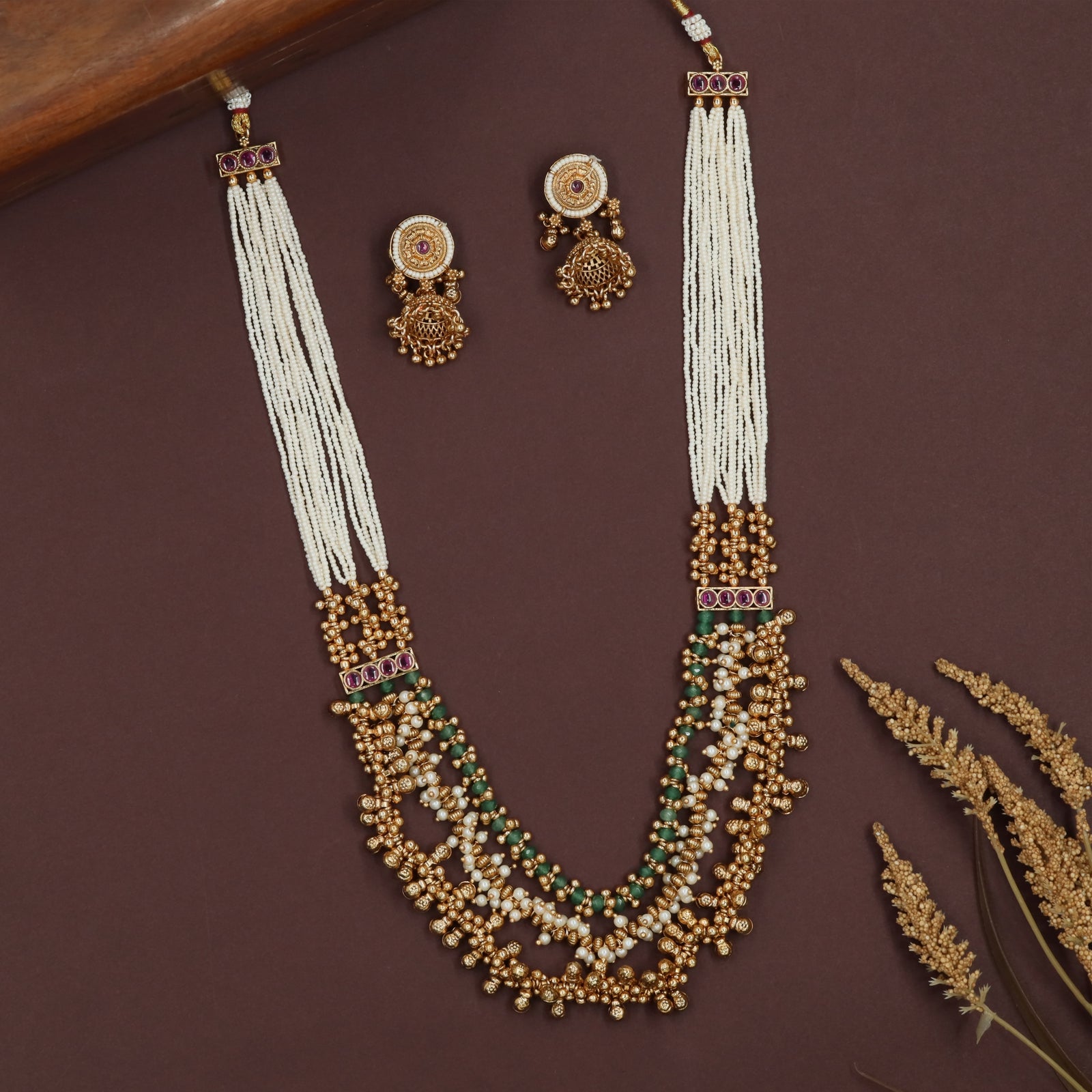 Multi strand pearl antique beads necklace with long layered strings and ornate bead cluster base