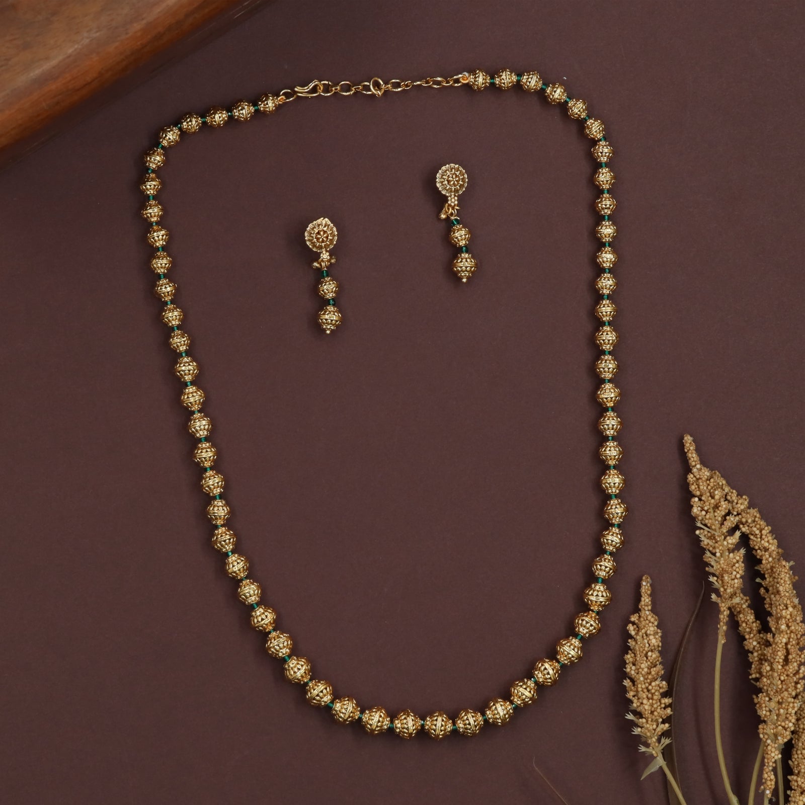 Grooved sphere antique beads necklace with evenly spaced carved units and smooth flow