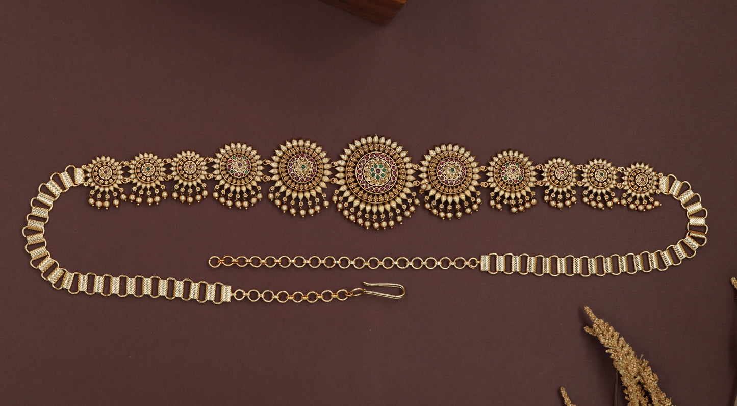 Sunburst medallion waist belt with graduated round panels and layered drop fringe
