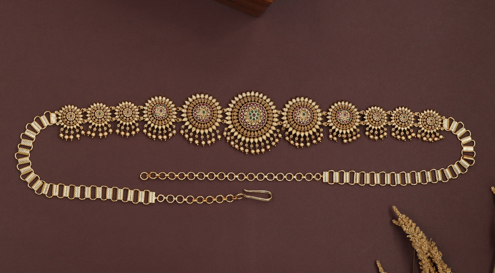 Sunburst medallion waist belt with graduated round panels and layered drop fringe