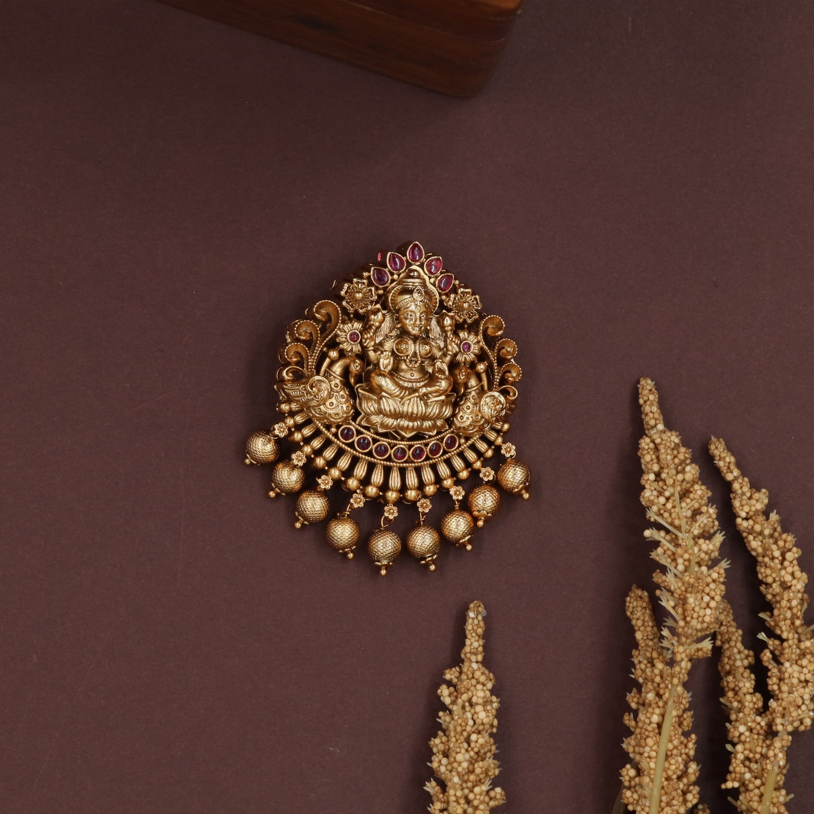 Sacred lakshmi jade bille with curved frame and layered bead fringe drops