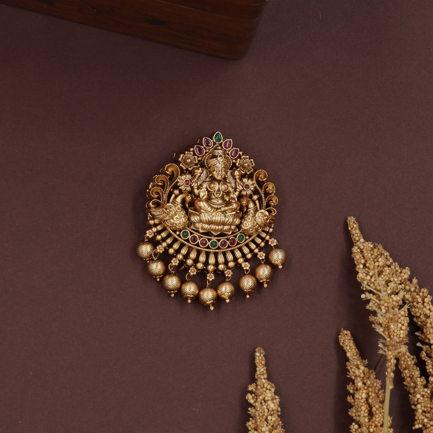 Sacred lakshmi jade bille with curved frame and layered bead fringe drops