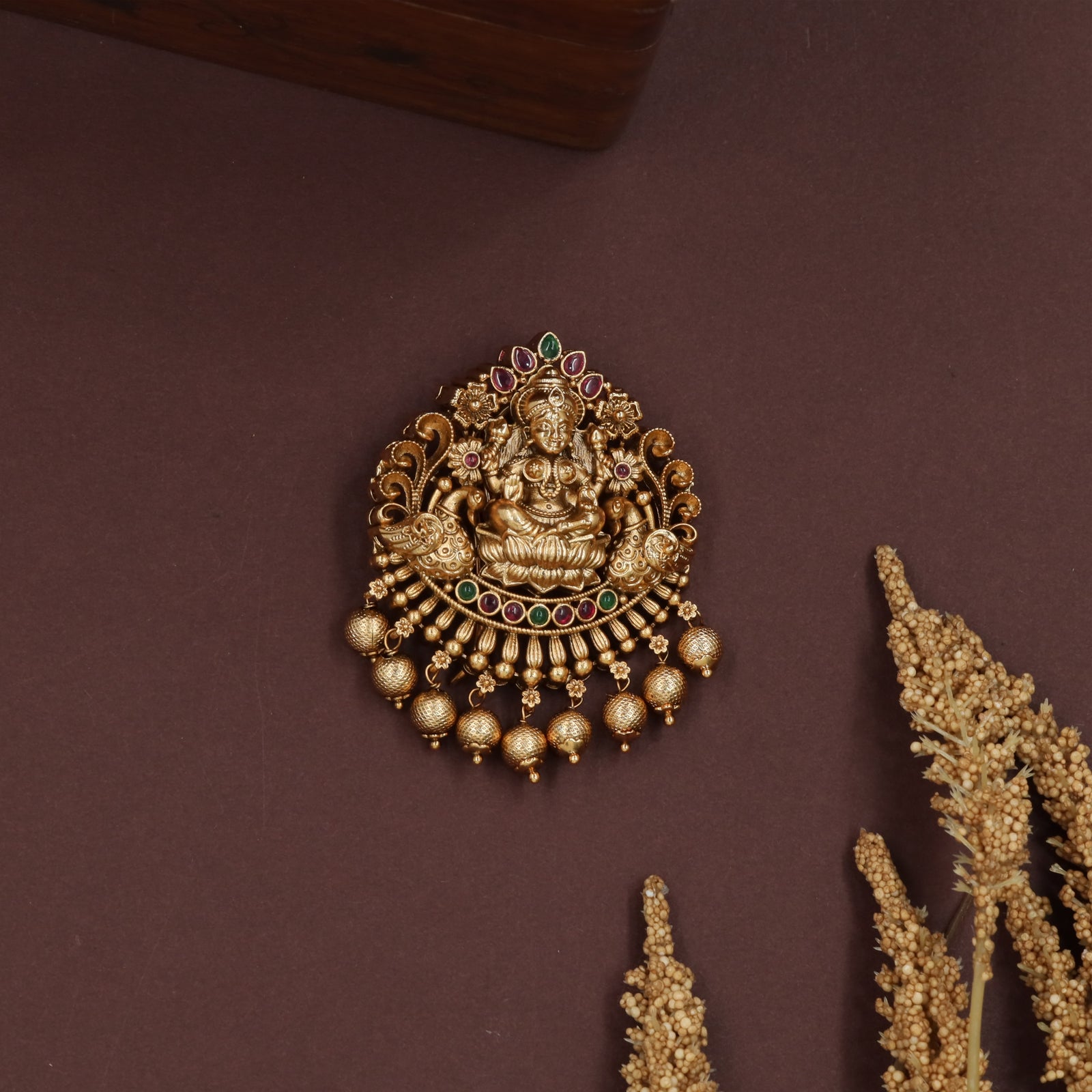 Sacred lakshmi jade bille with curved frame and layered bead fringe drops
