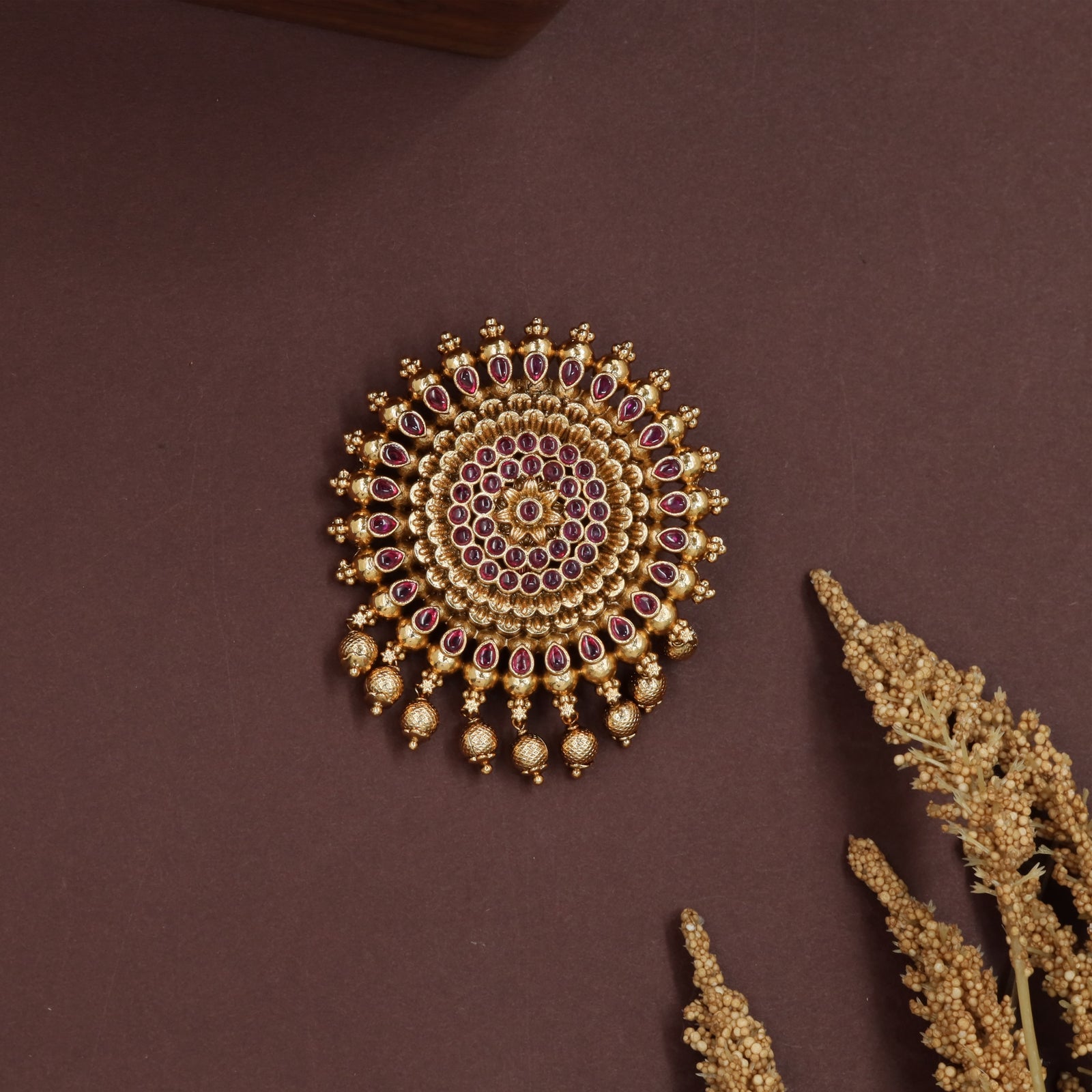 Radiating ring jade bille with concentric bead rows and drop fringe edging