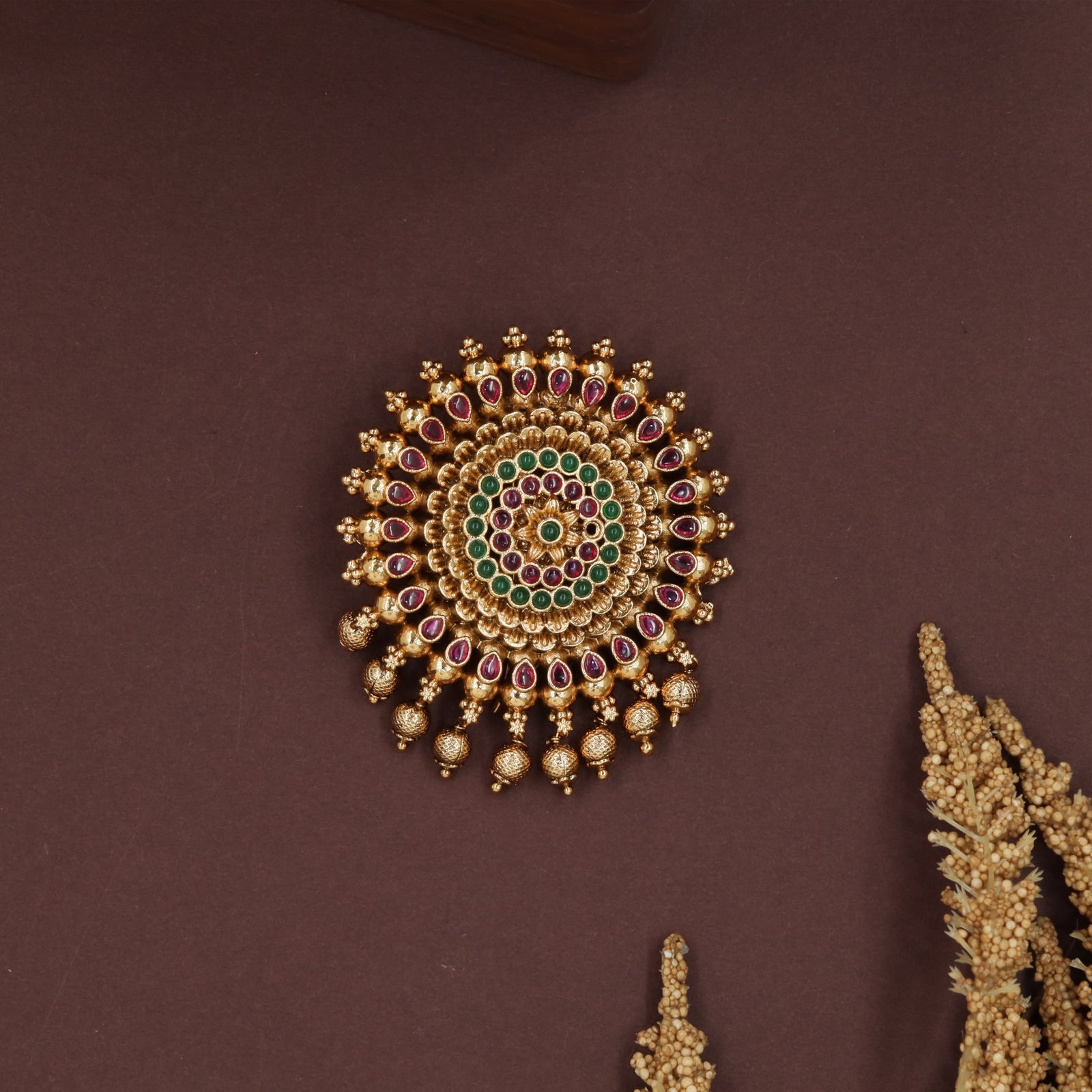 Radiating ring jade bille with concentric bead rows and drop fringe edging