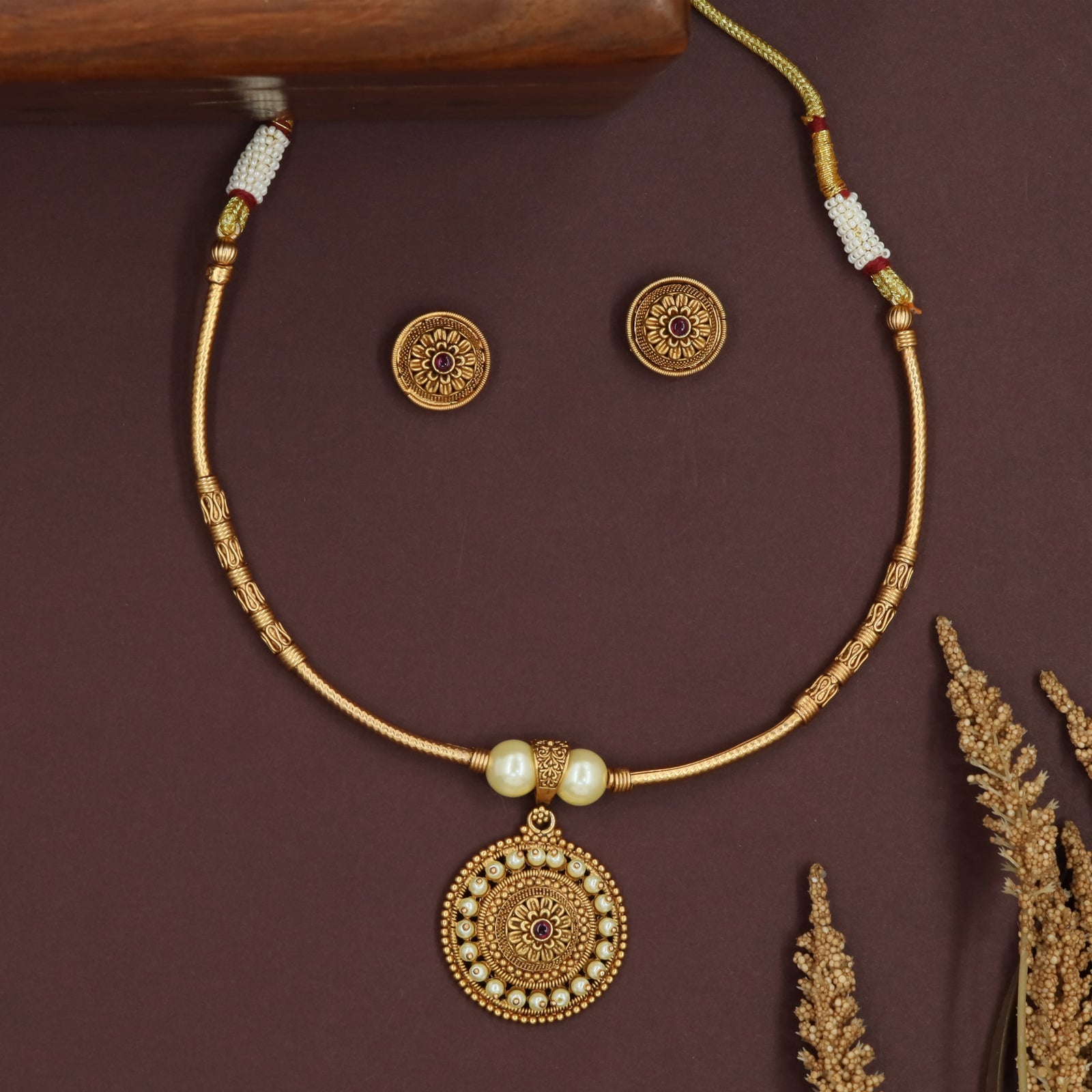 Sleek chain antique necklace with carved segments and circular drop pendant