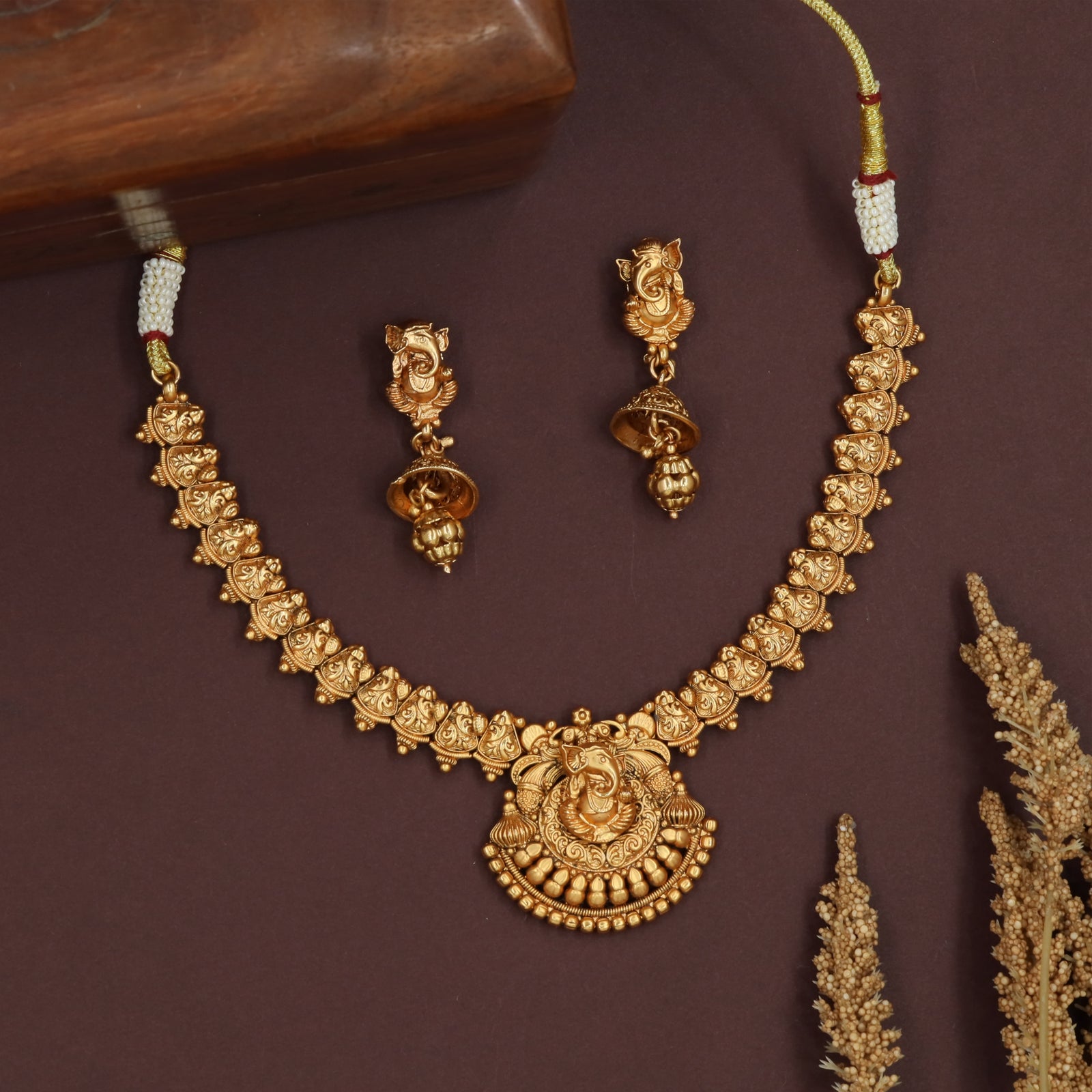 Devotional ganesha antique necklace with carved segments and round centerpiece