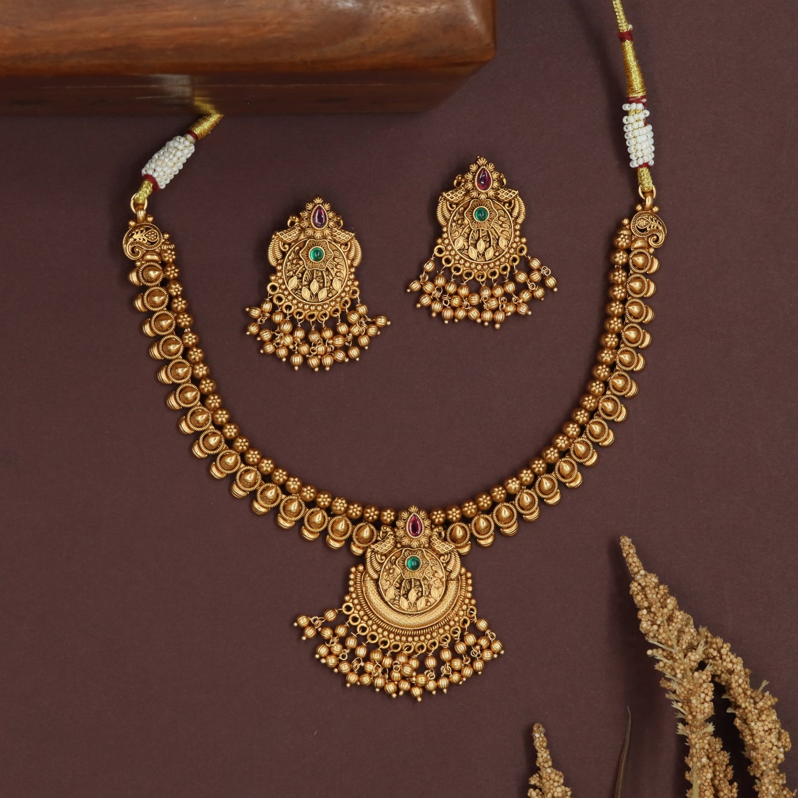 Teardrop row antique necklace with rounded bead line and central medallion pendant