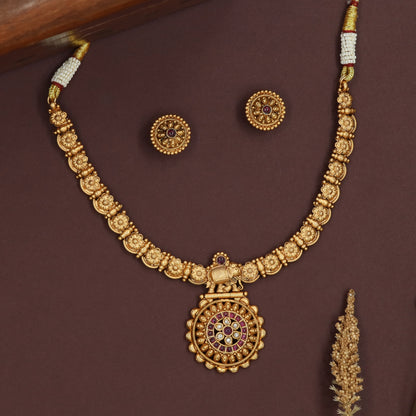 Floral link kundan necklace with carved flower panels and central elephant pendant